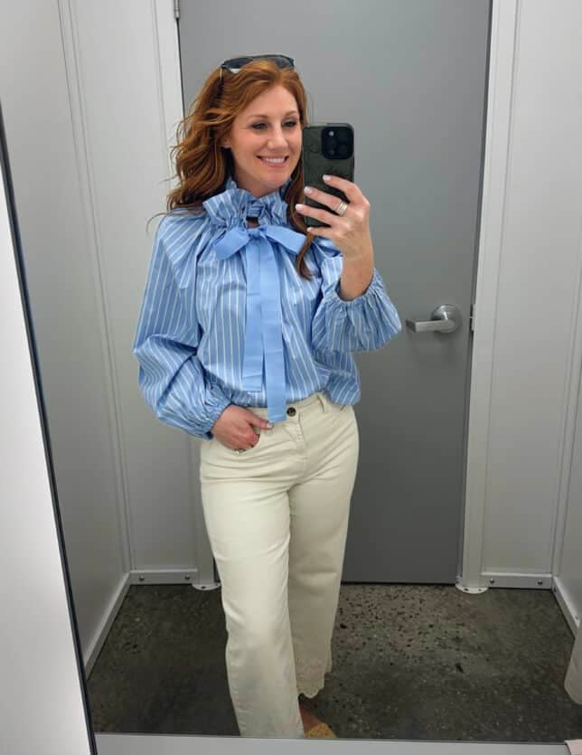 Stephanie wearing a striped blouse with a bow and ivory eyelet jeans from Walmart