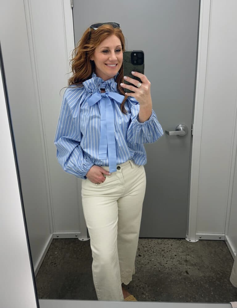 Stephanie wearing a striped blouse with a bow and ivory eyelet jeans from Walmart