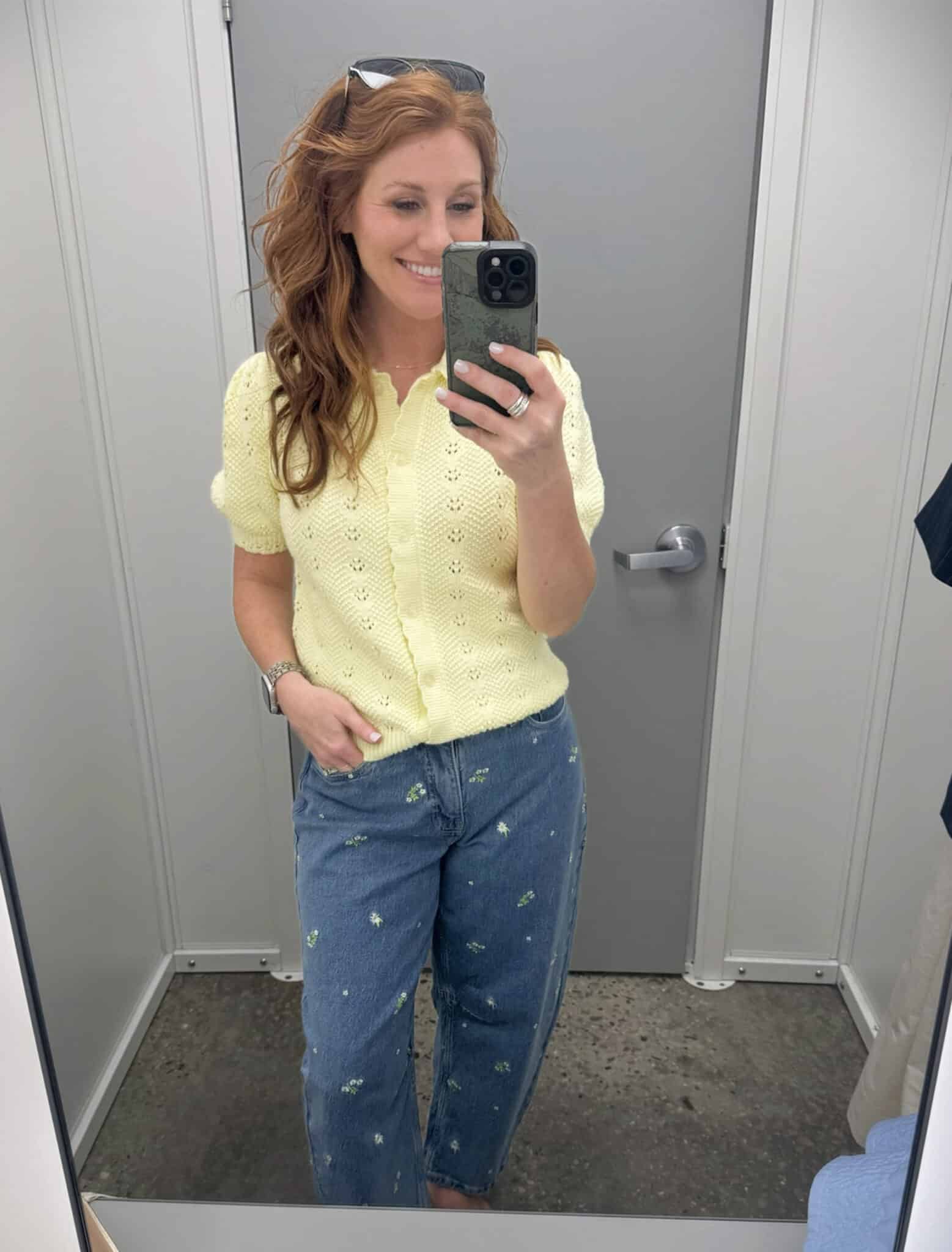 Stephanie wearing a yellow button cardigan sweater with embroidered jeans from Walmart
