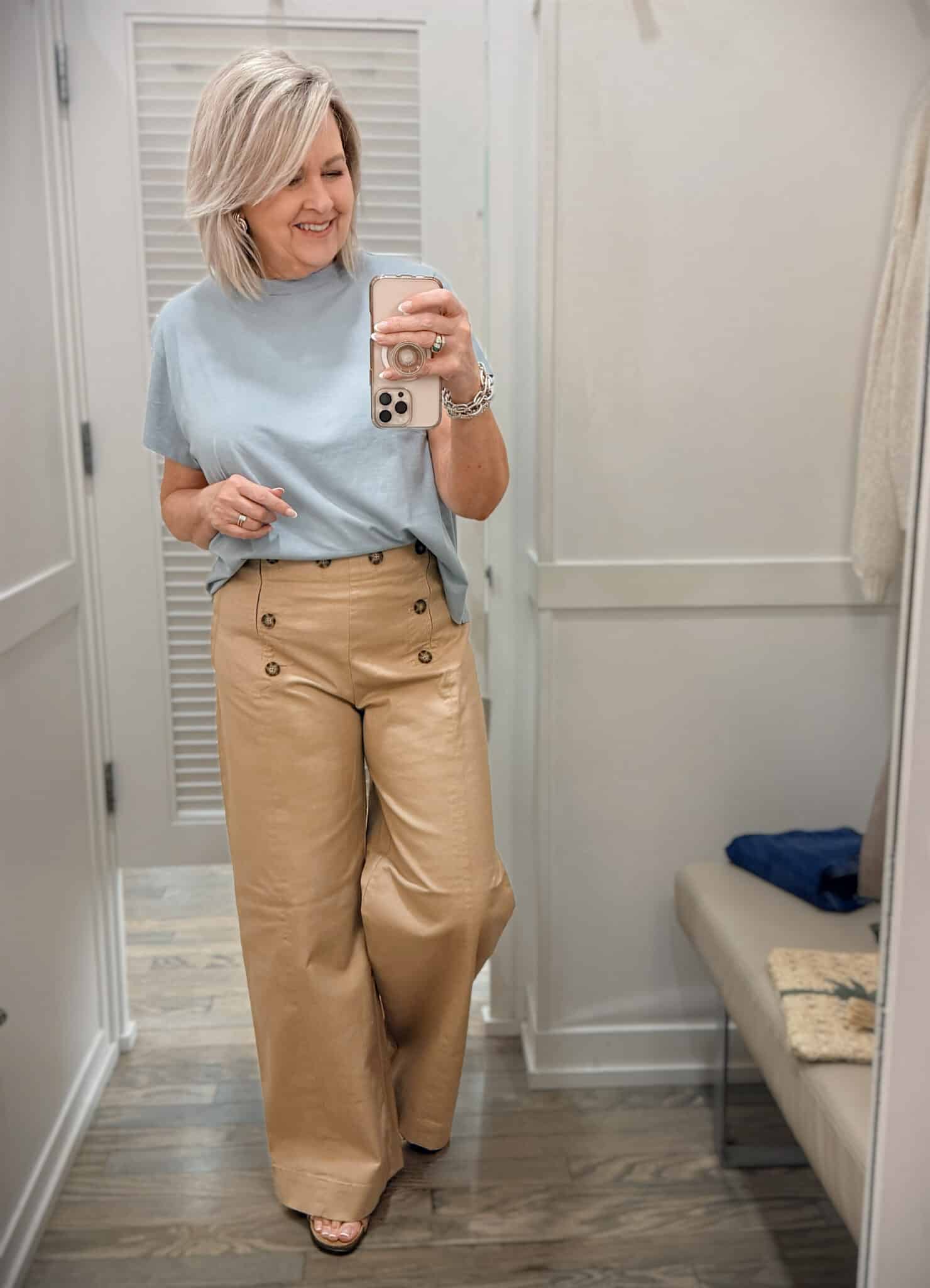 Tania wearing an blue relaxed tee with tan sailor pants from Loft