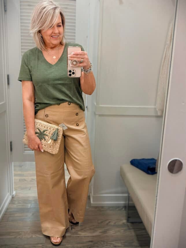 Tania wearing an olive v-neck tee with tan sailor pants from Loft