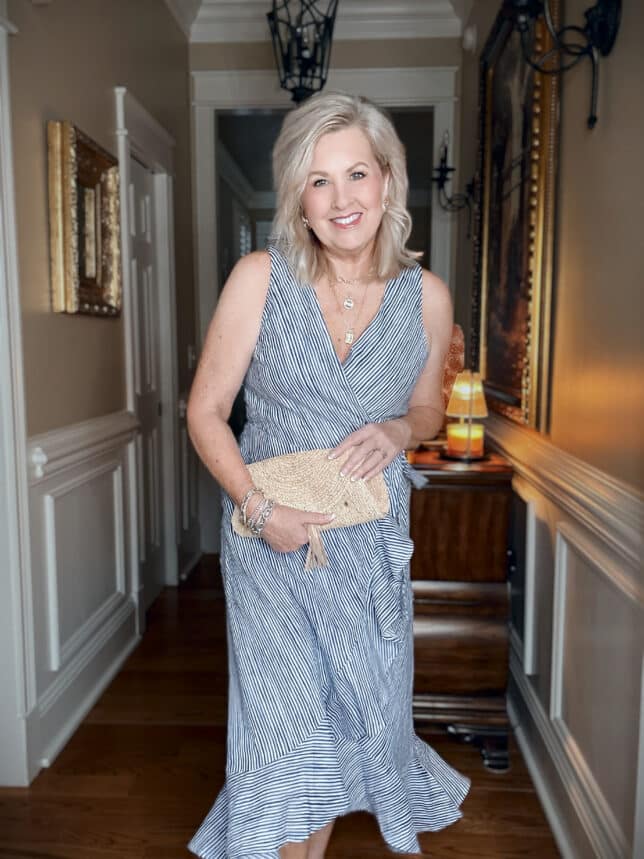 Tania wearing a Tommy Bahama blue striped wrap dress for vacation
