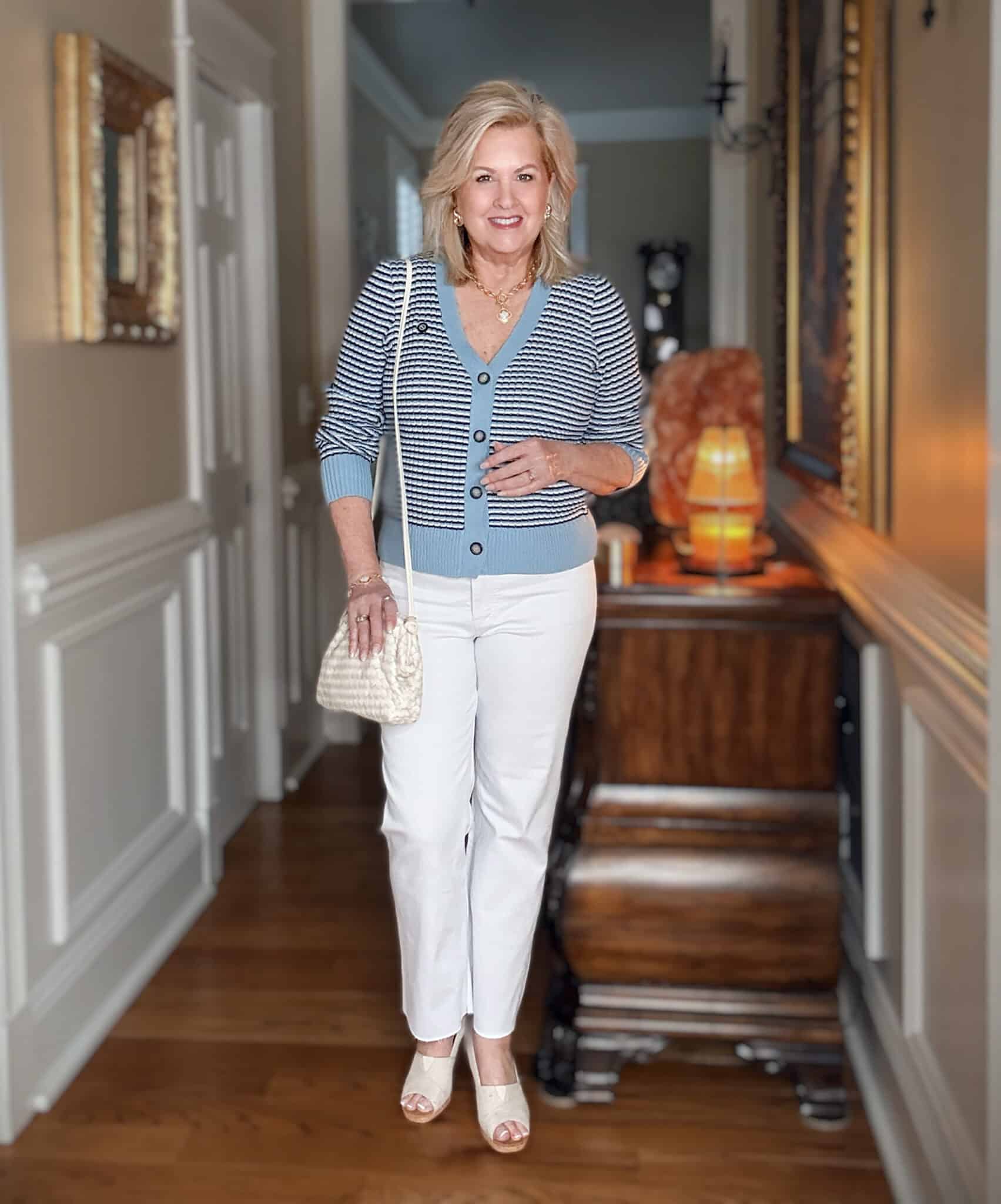 Tania wearing a striped cardigan and white jeans from Nordstrom