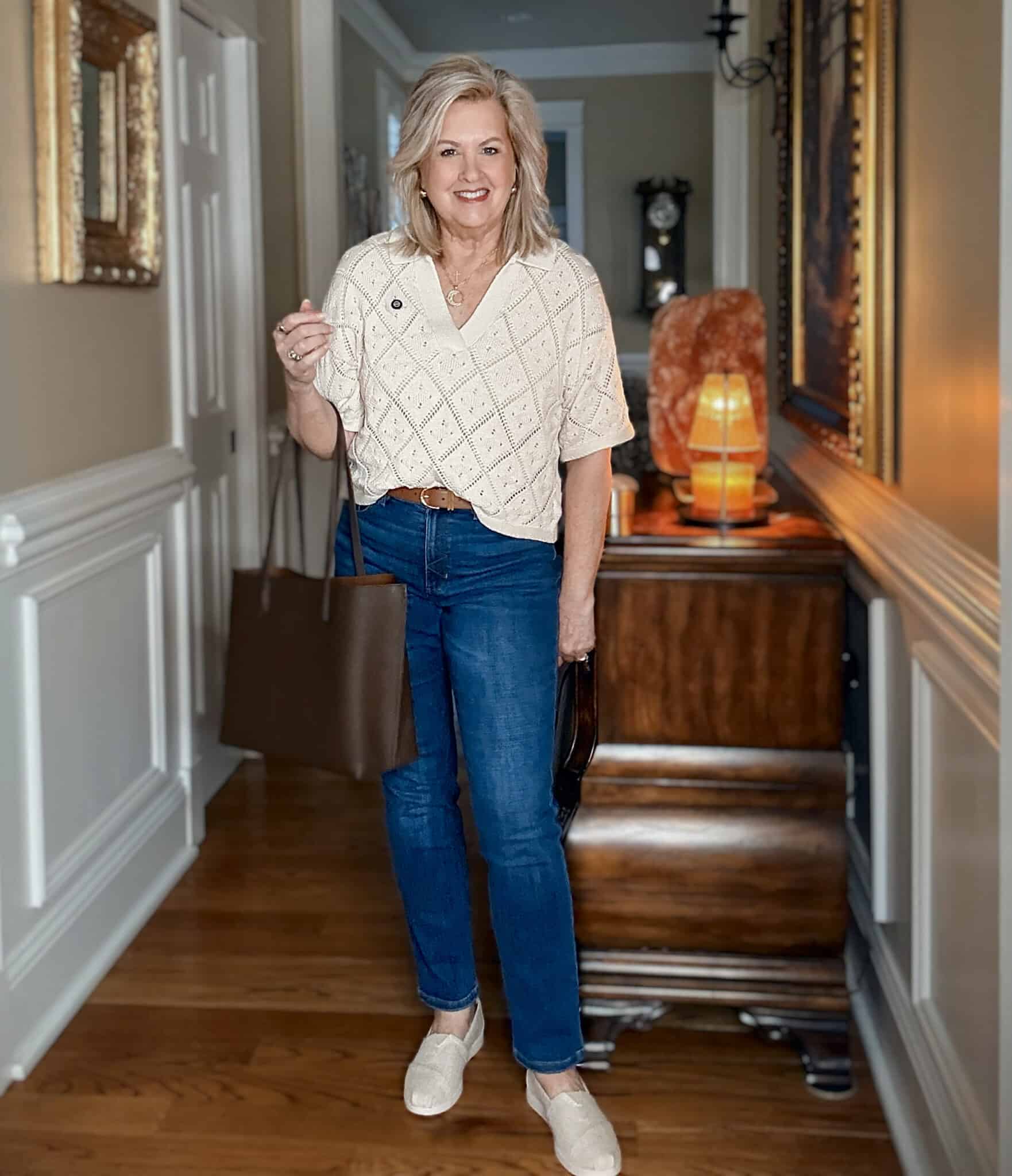 Tania wearing a Pointelle knit sweater and jeans from Nordstrom