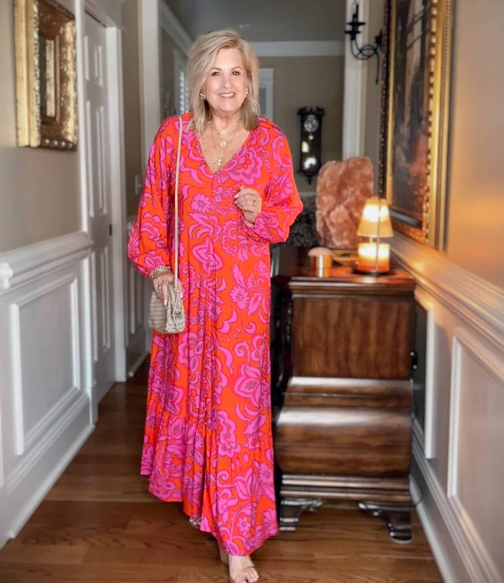 Tania wearing a long sleeve bright pink maxi dress by SUGARLIPS
