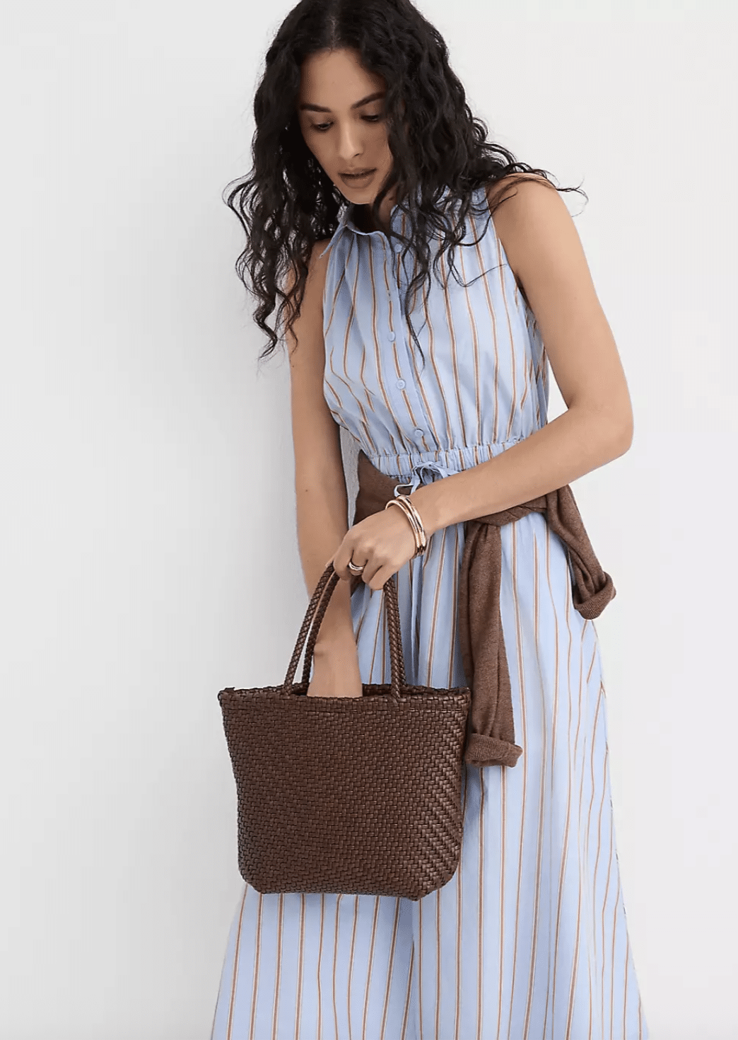 Woman wearing LOFT striped cotton dress with an elastic waist.