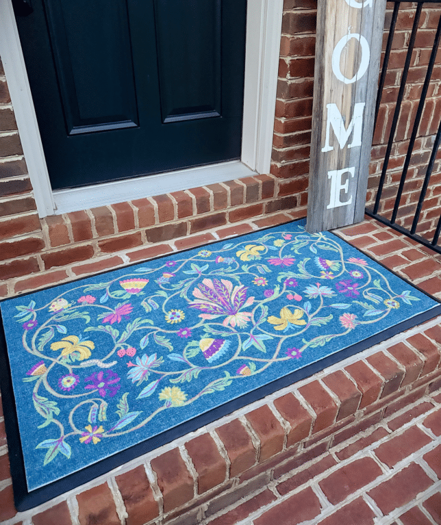 A bright and colorful doormat to welcome your guests.