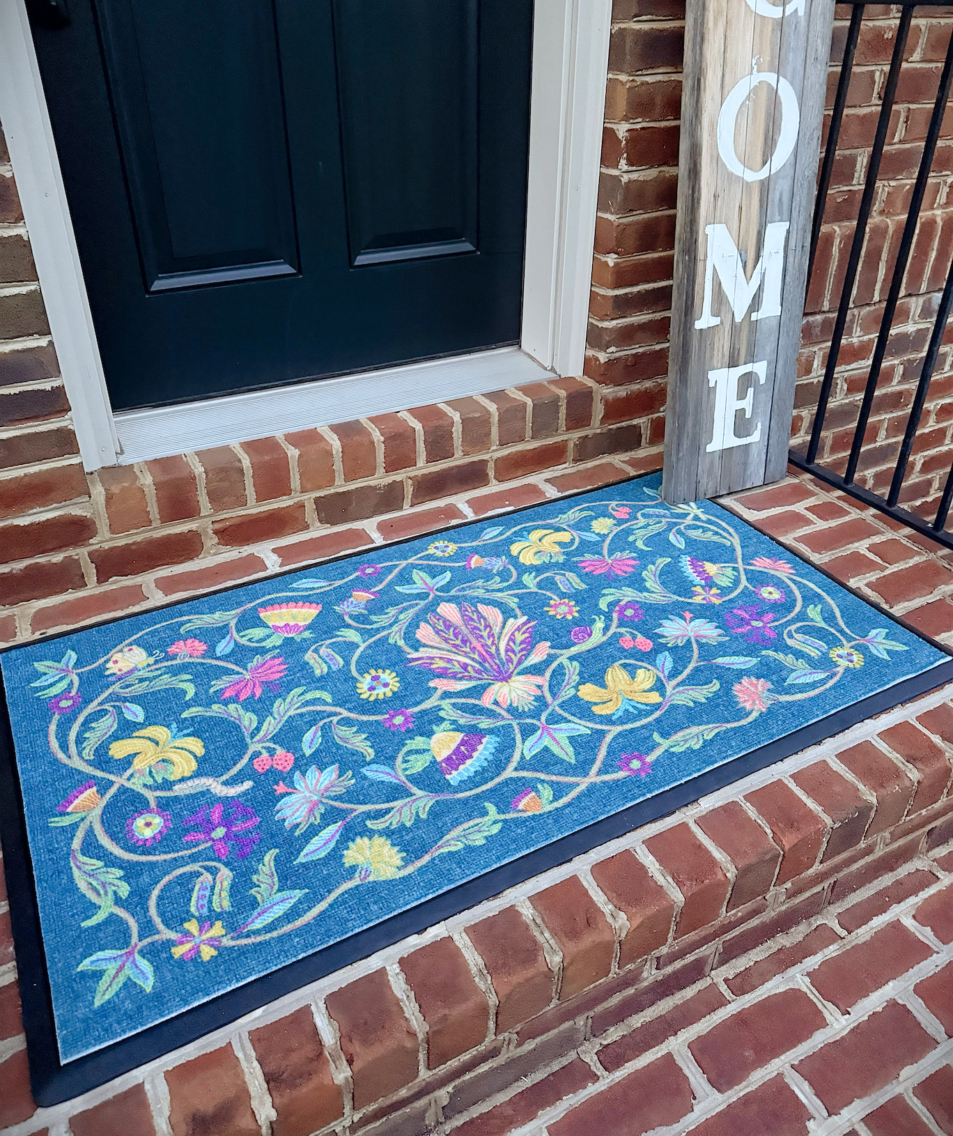 A bright and colorful doormat from Ruggable to welcome your guests.