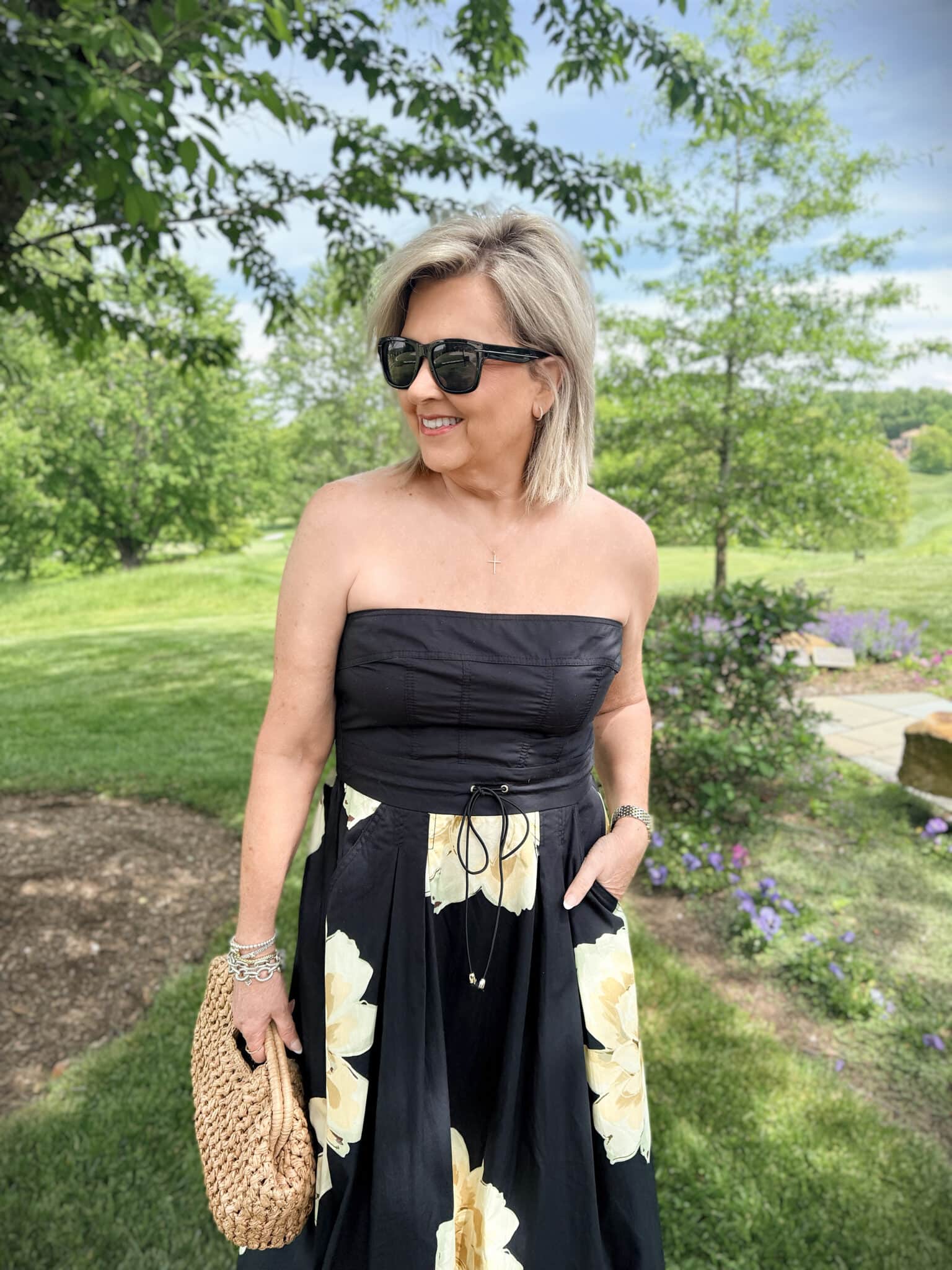 Tania wearing a black dress with flowers