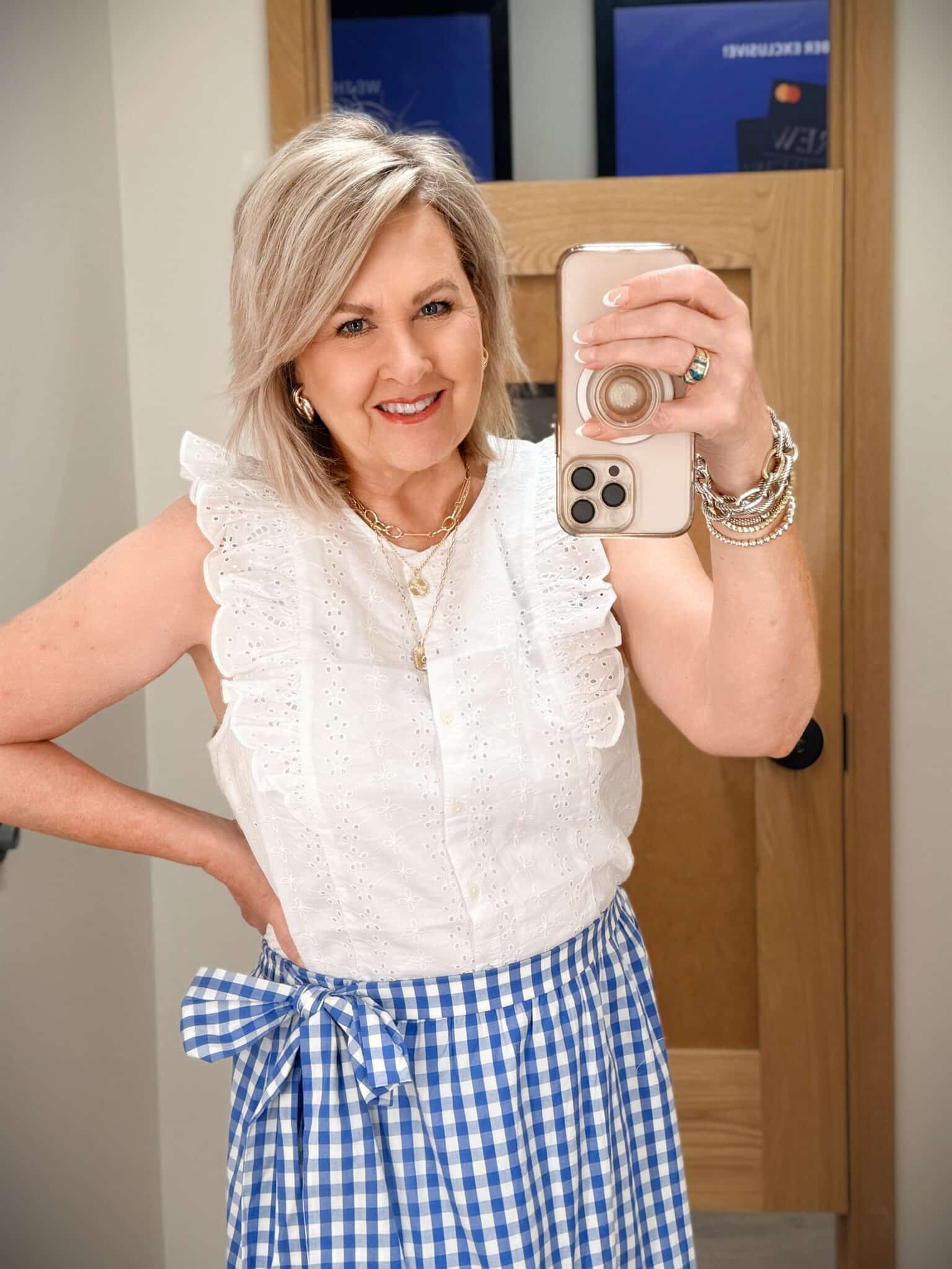 Tania wearing a white ruffle sleeve top from J.Crew Factory