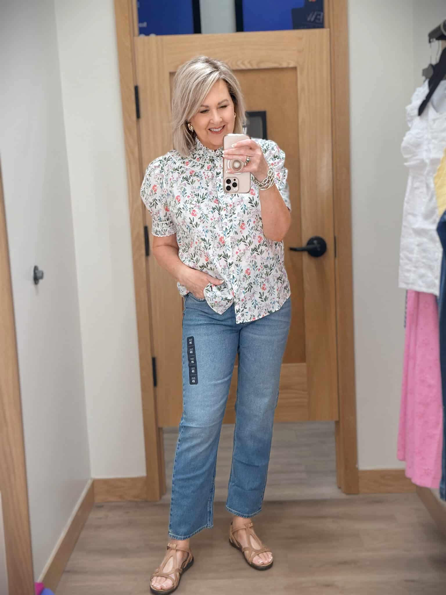 Tania wearing a floral puff sleeve top with a pair of jeans from J.Crew Factory