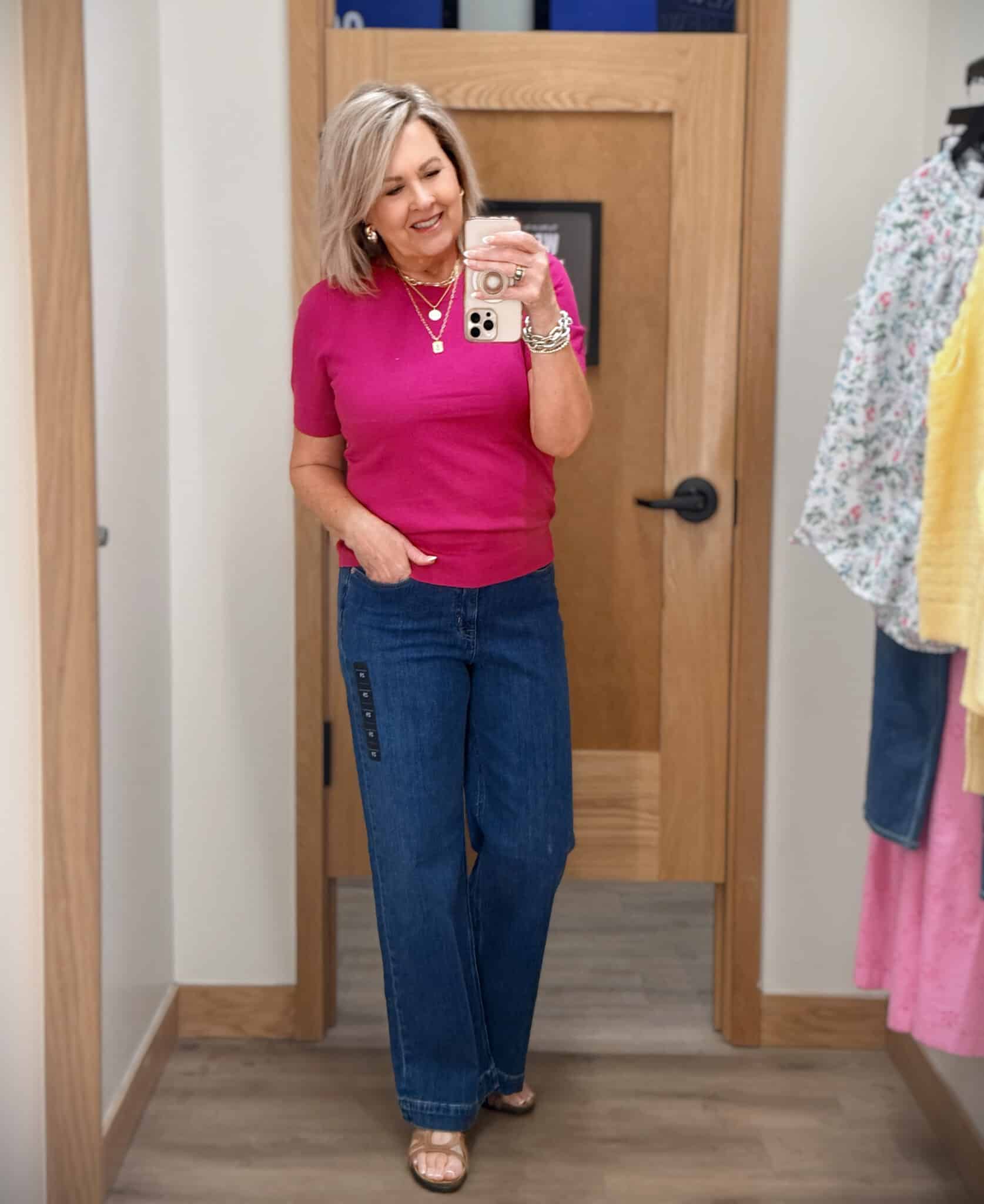 Tania wearing a dark fuchsia sweater with a pair of wide leg jeans from J.Crew Factory