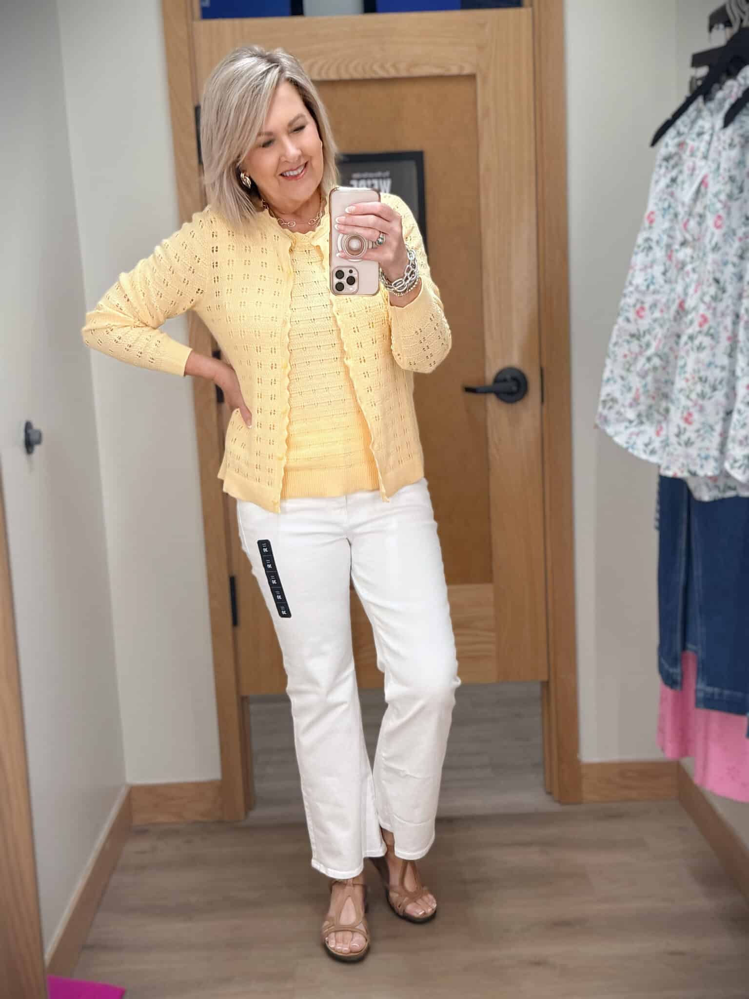 Tania wearing a yellow Pointelle cardigan and tank set with a pair of white jeans from J.Crew Factory