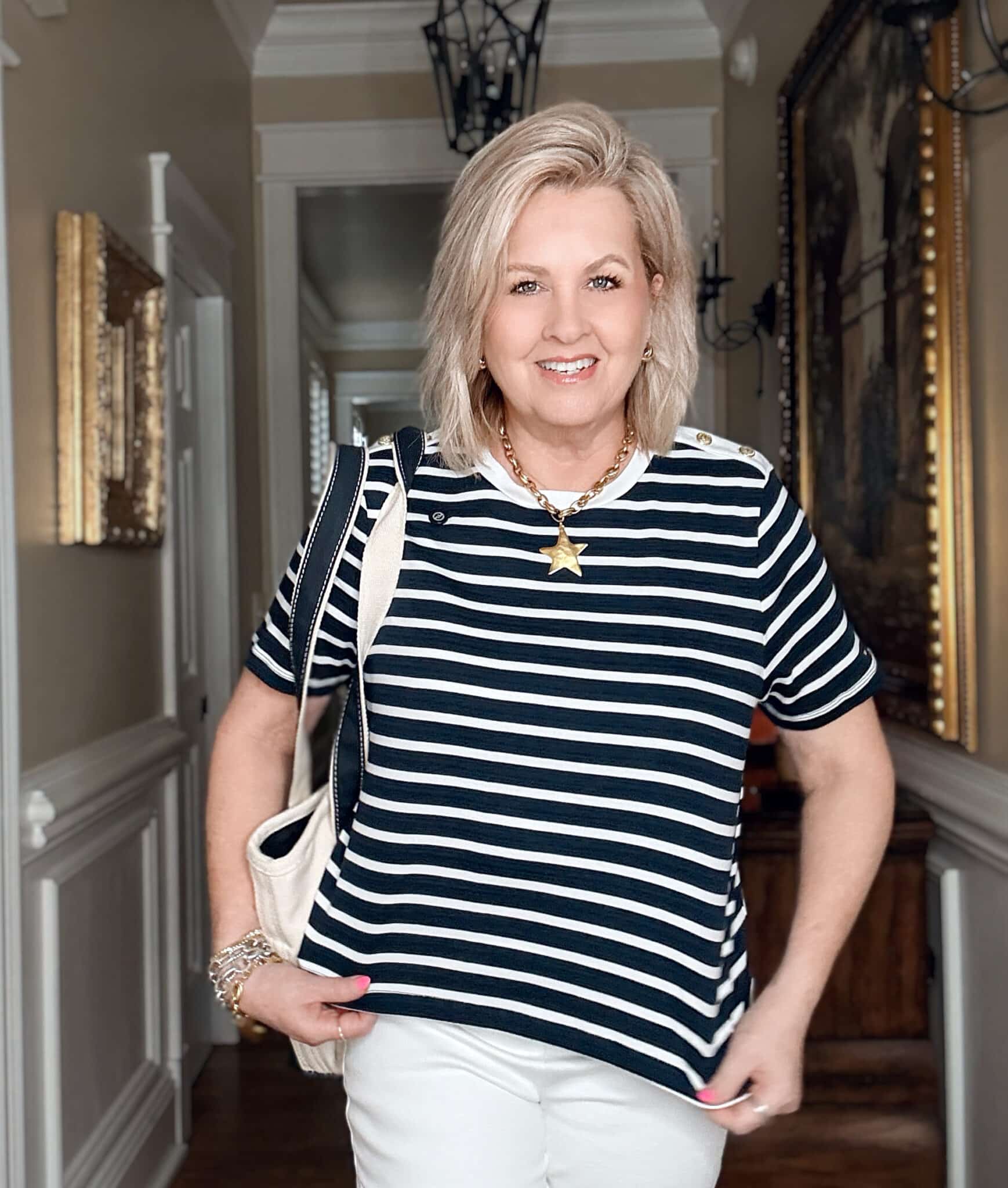 Tania wearing a striped white and navy top