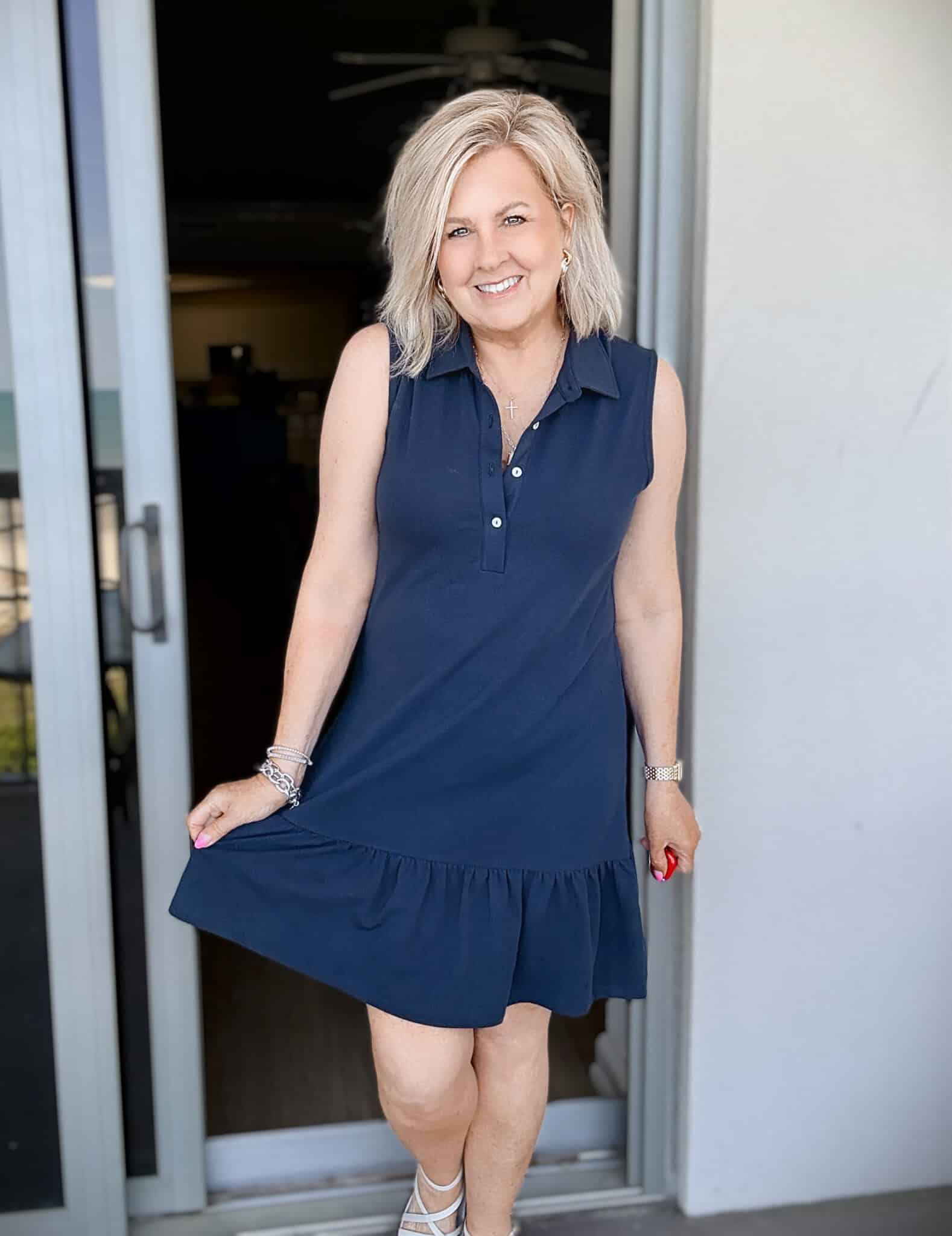 Tania wearing a  Spartina 449 navy ruffle sheath dress at the beach