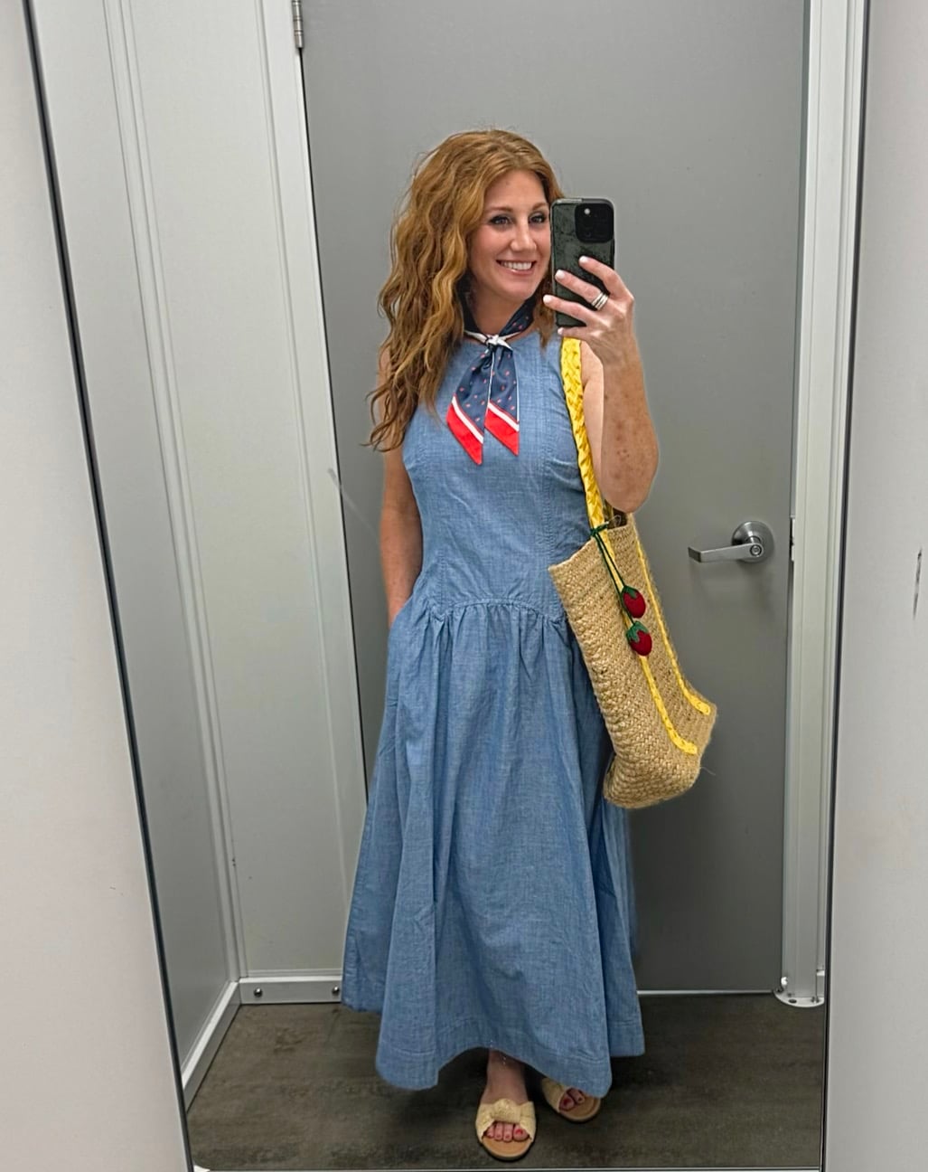 Stephanie is wearing a chambray dress with a red white & blue scarf