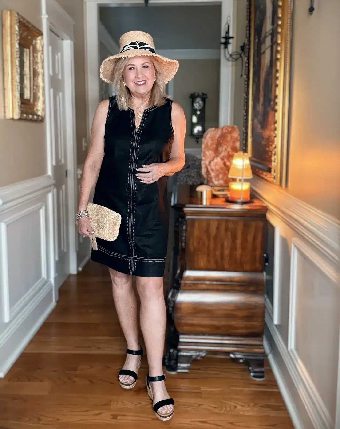 Tania wearing a black shift dress summer 2026.
