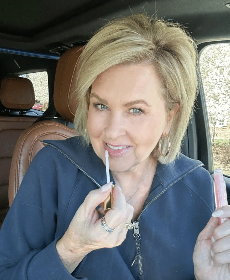 Tania applying lip gloss after lip liner