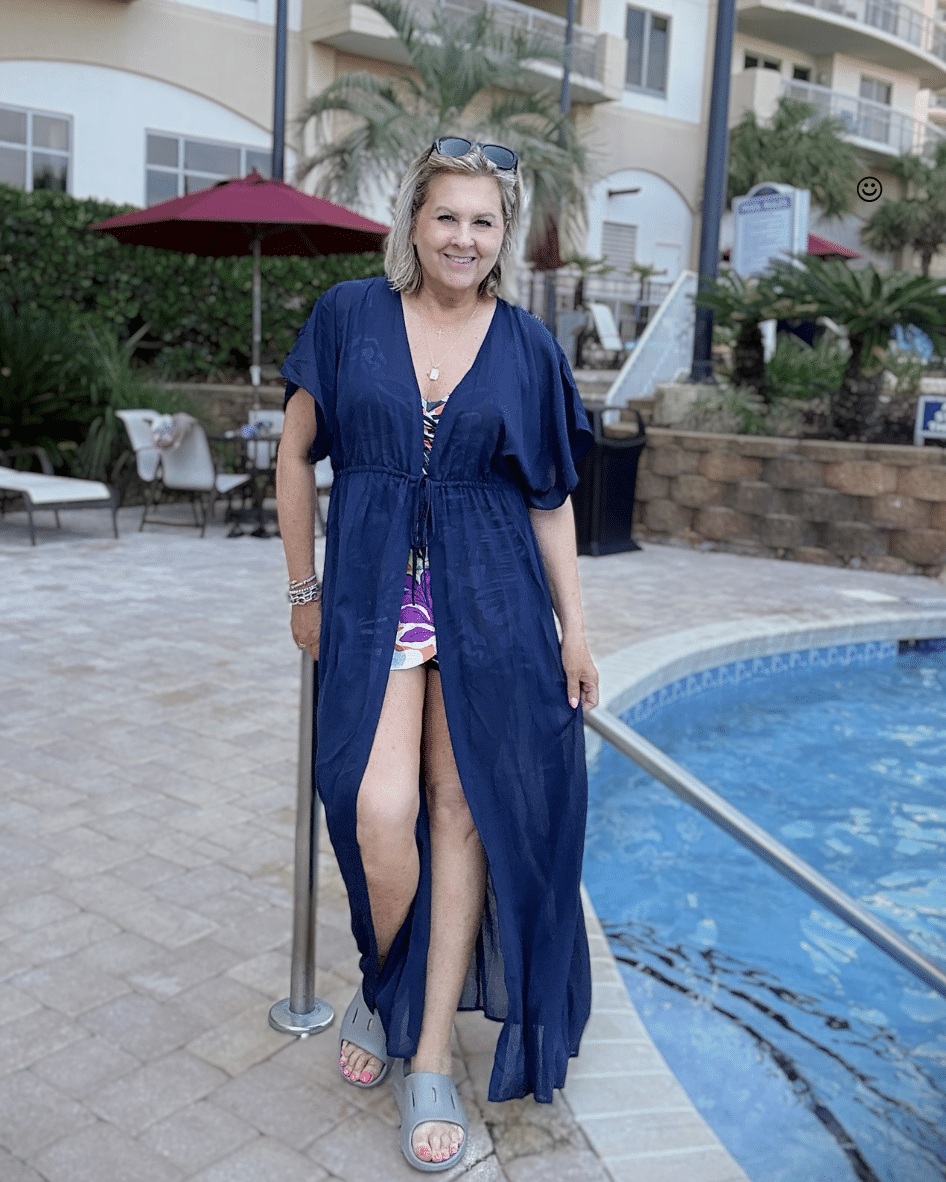 Tania wearing a navy swimsuit coverup to minimize large looking thighs