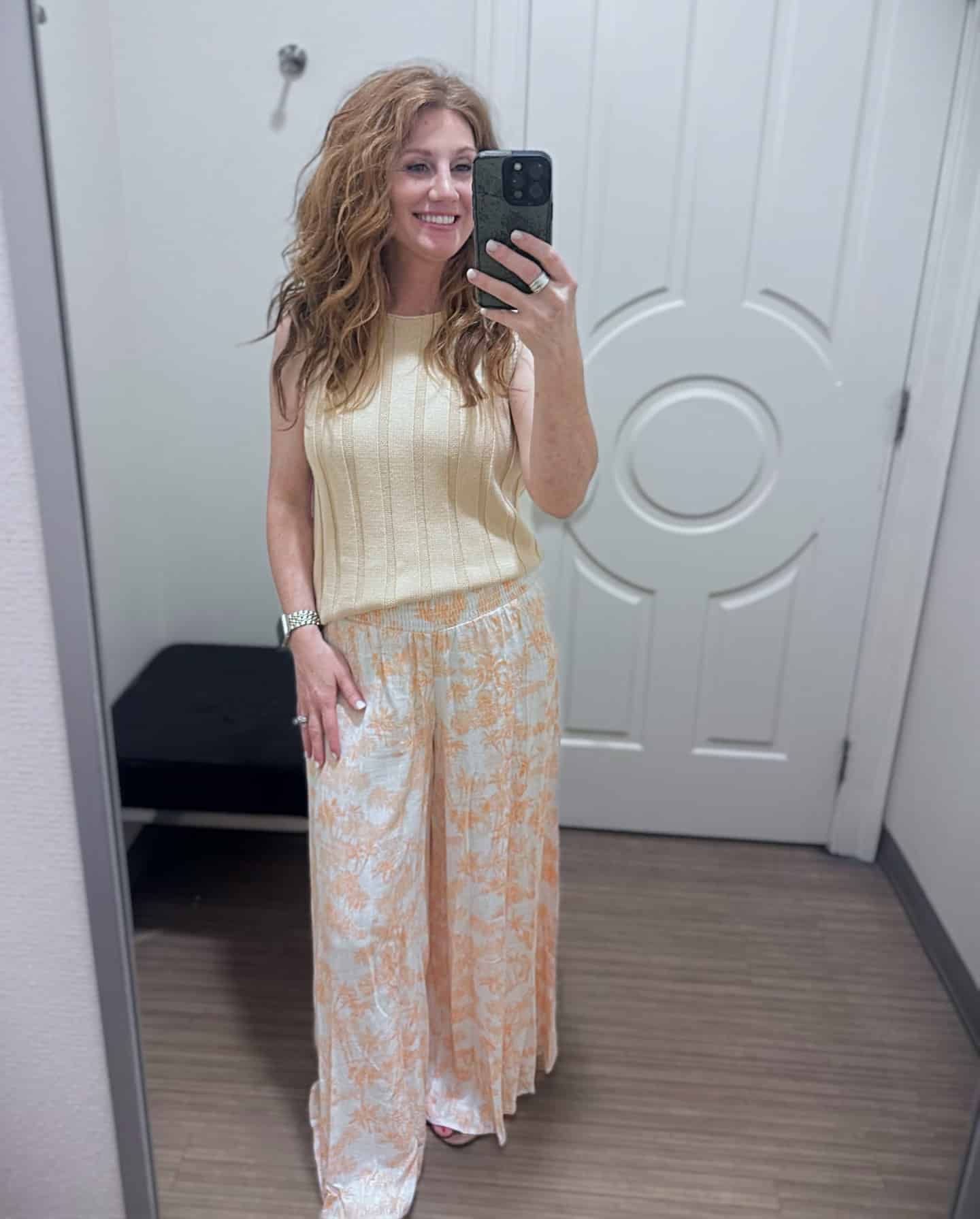 Stephanie wearing a sleeveless neutral sweater with scenic linen pull-on pants from Belk.