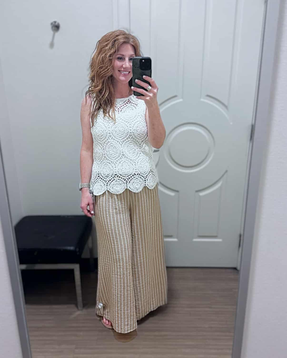 Stephanie wearing a sleeveless crochet tank with striped linen pull-on pants from Belk.