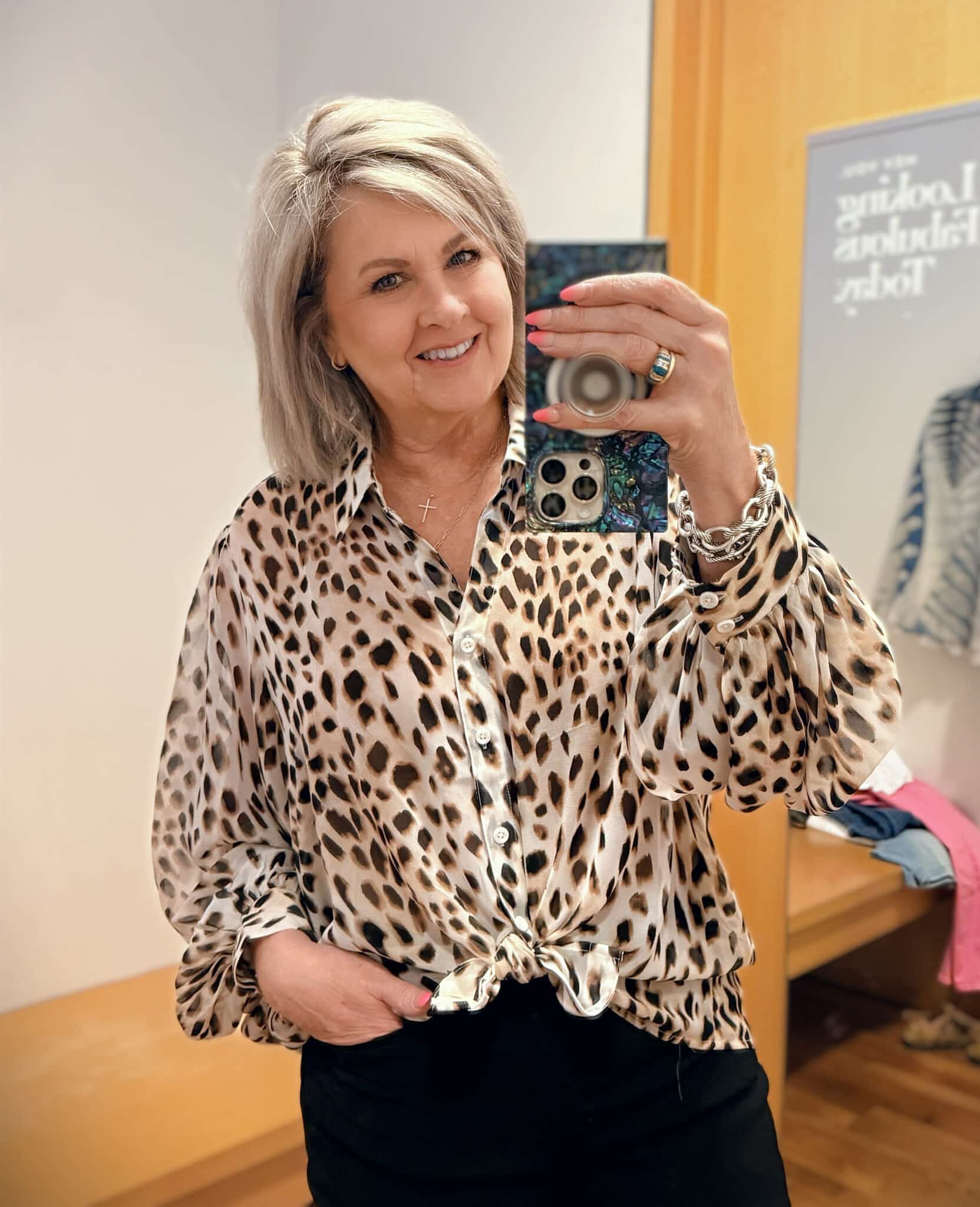 Tania wearing a sheer leopard print top from Chicos