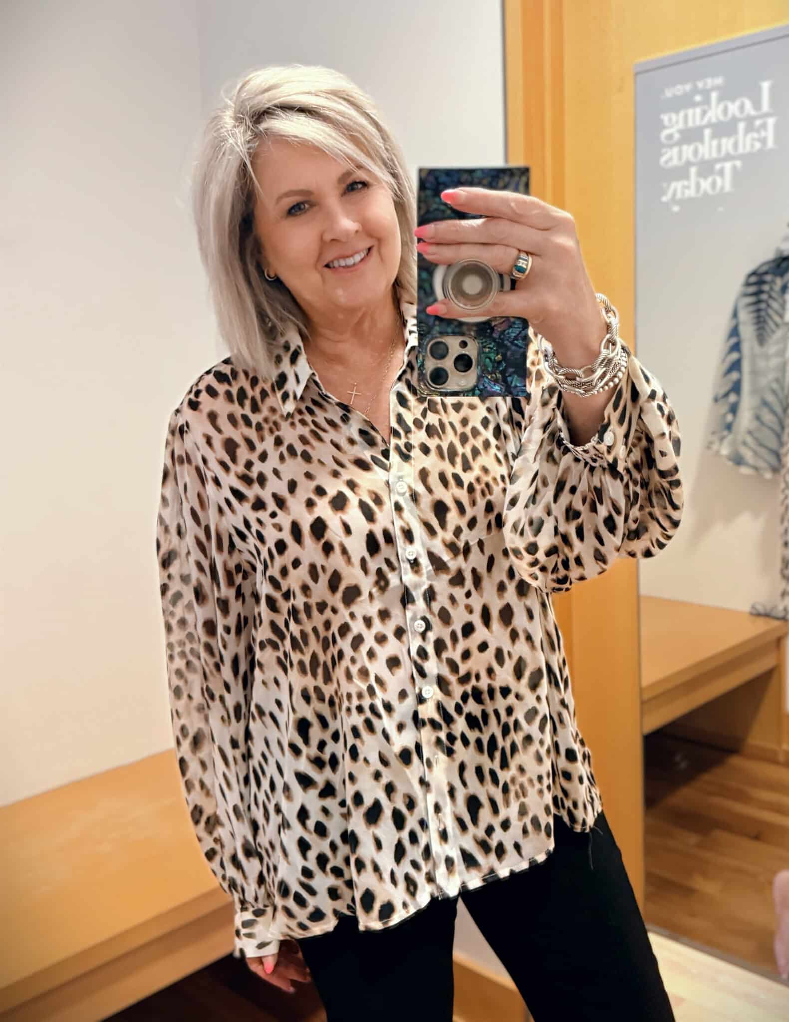 Tania wearing a button up leopard print top from Chicos
