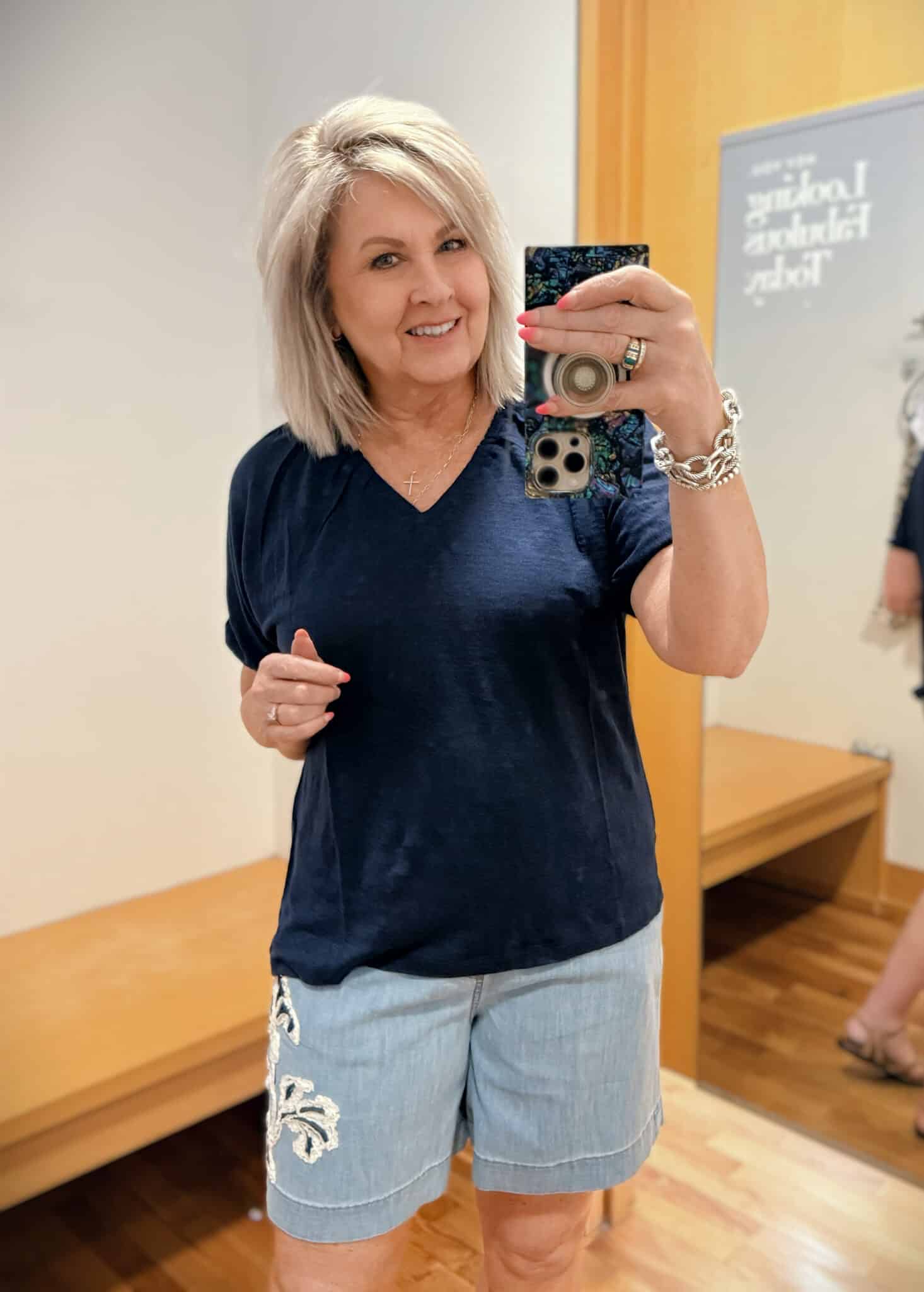 Tania wearing a blue top from Chicos