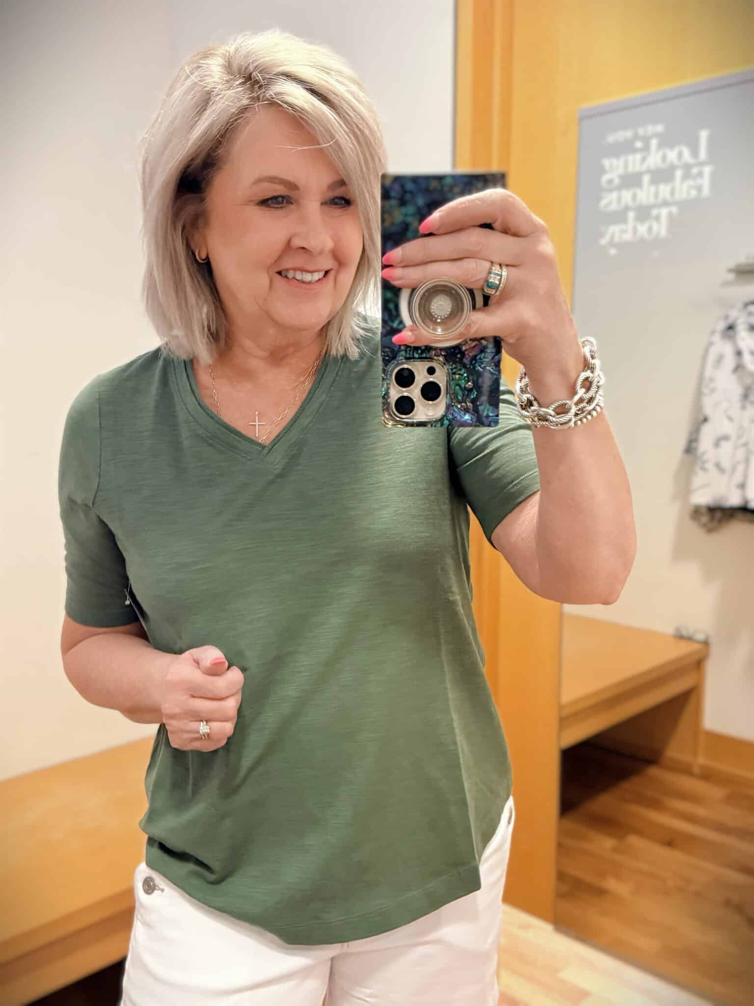 Tania wearing an olive colored tee from Chicos
