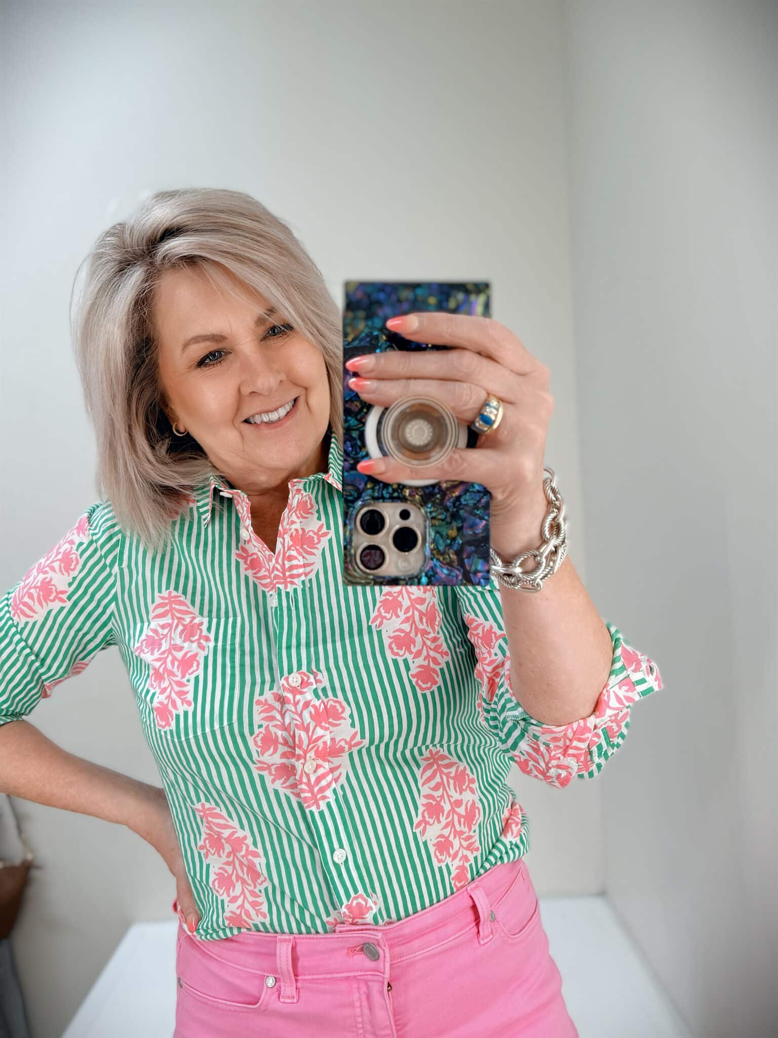 Tania wearing a green and pin button shirt from J.Crew Factory
