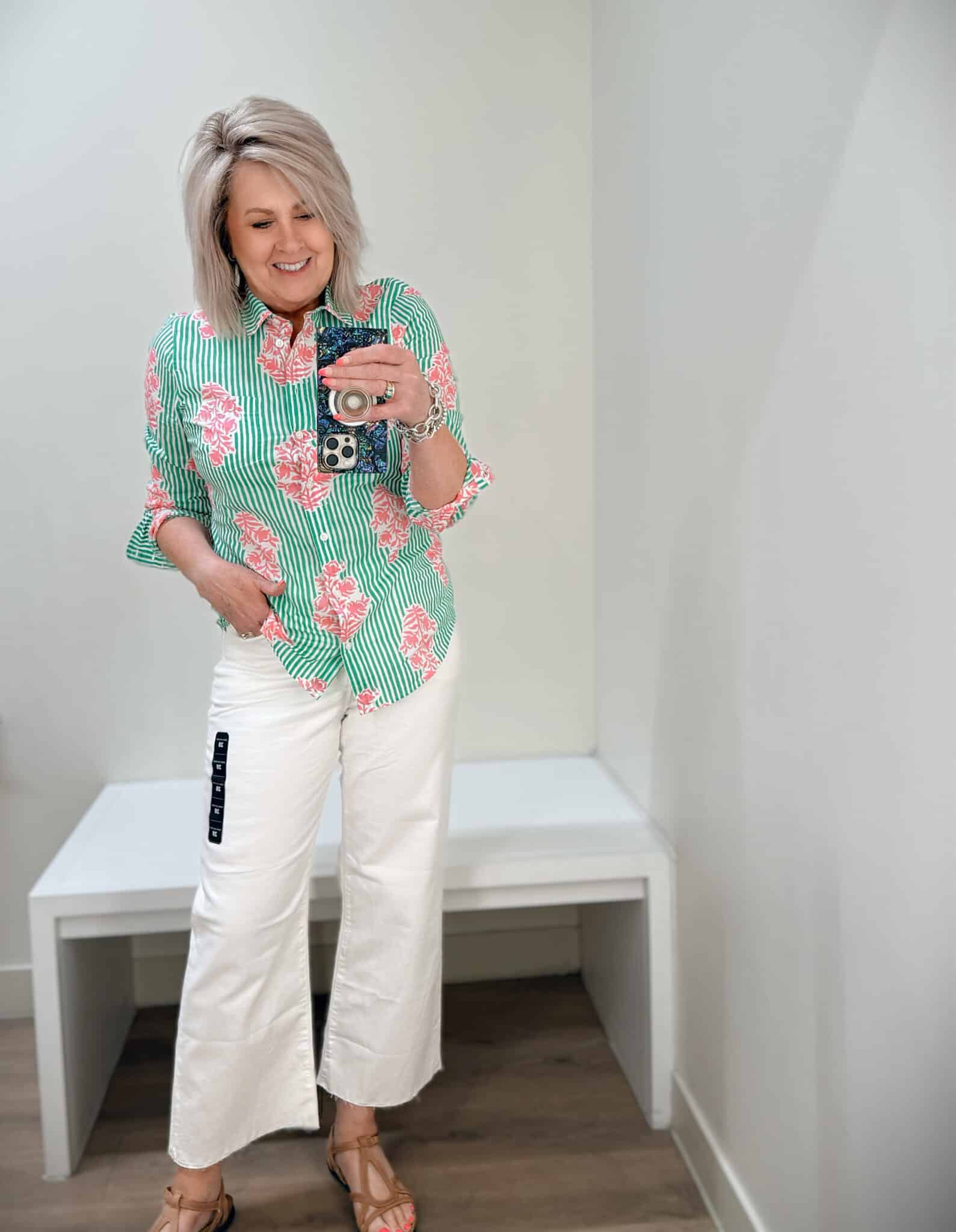 Tania wearing a green and pin button shirt and white crop jeans from J.Crew Factory
