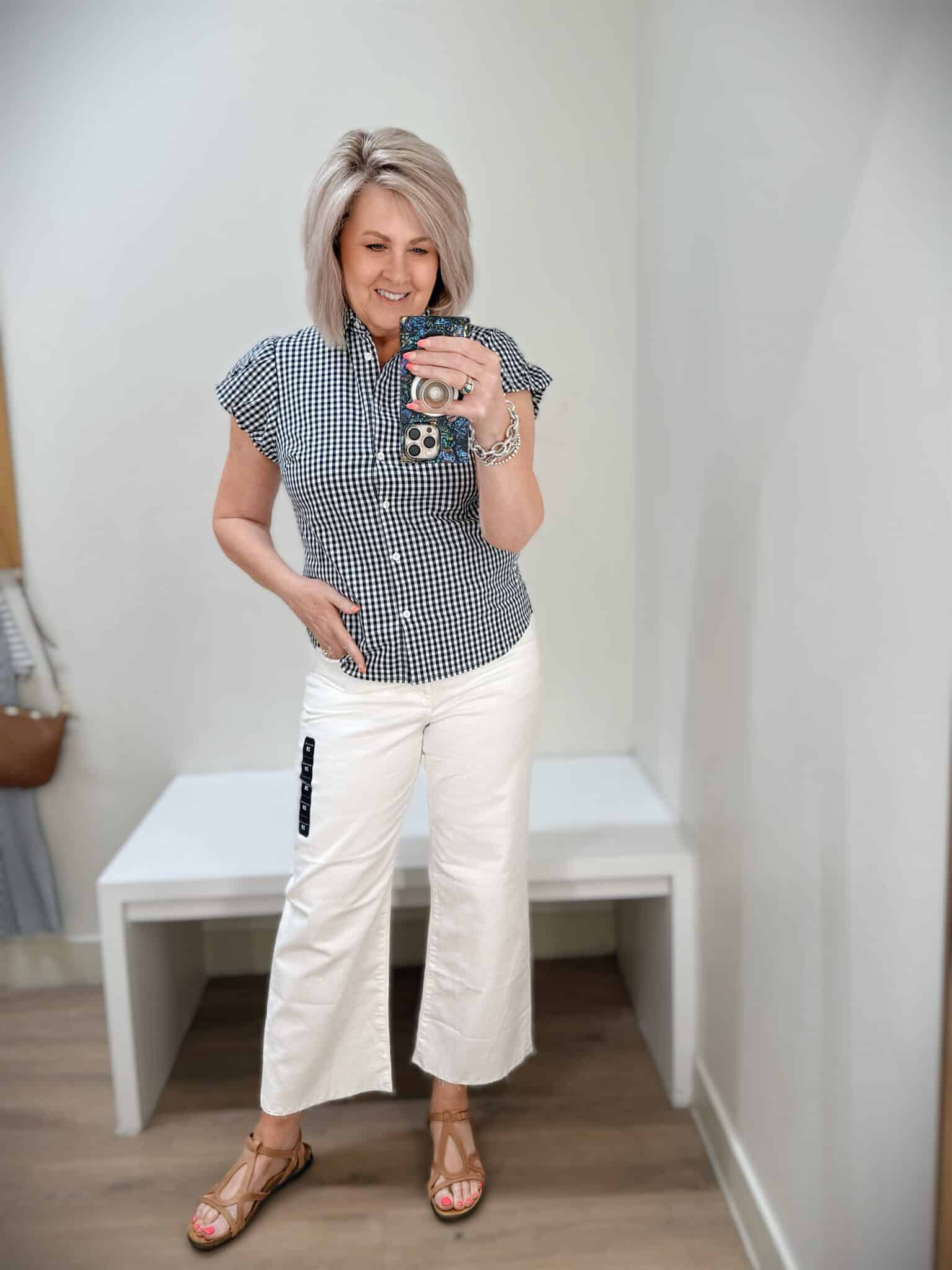 Tania wearing a gingham button shirt and white crop jeans from J.Crew Factory