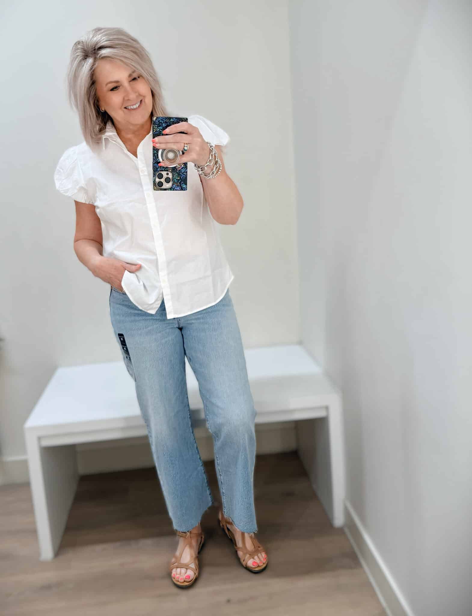 Tania wearing a white button shirt and crop jeans from J.Crew Factory