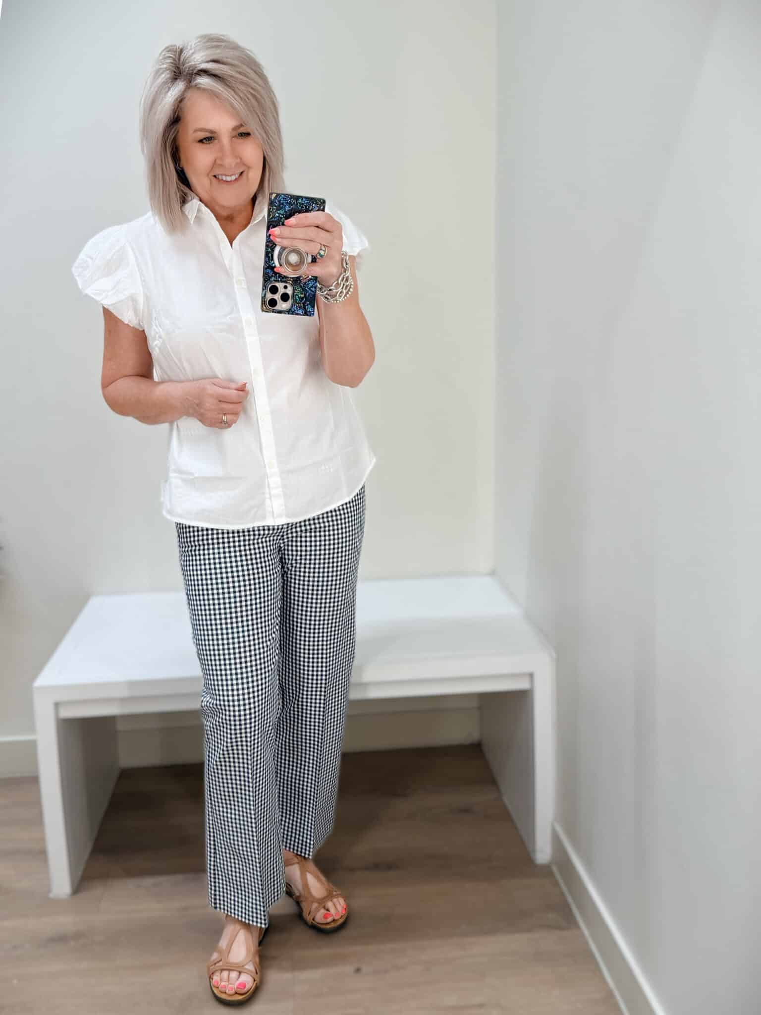 Tania wearing a white button shirt and gingham crop pants from J.Crew Factory
