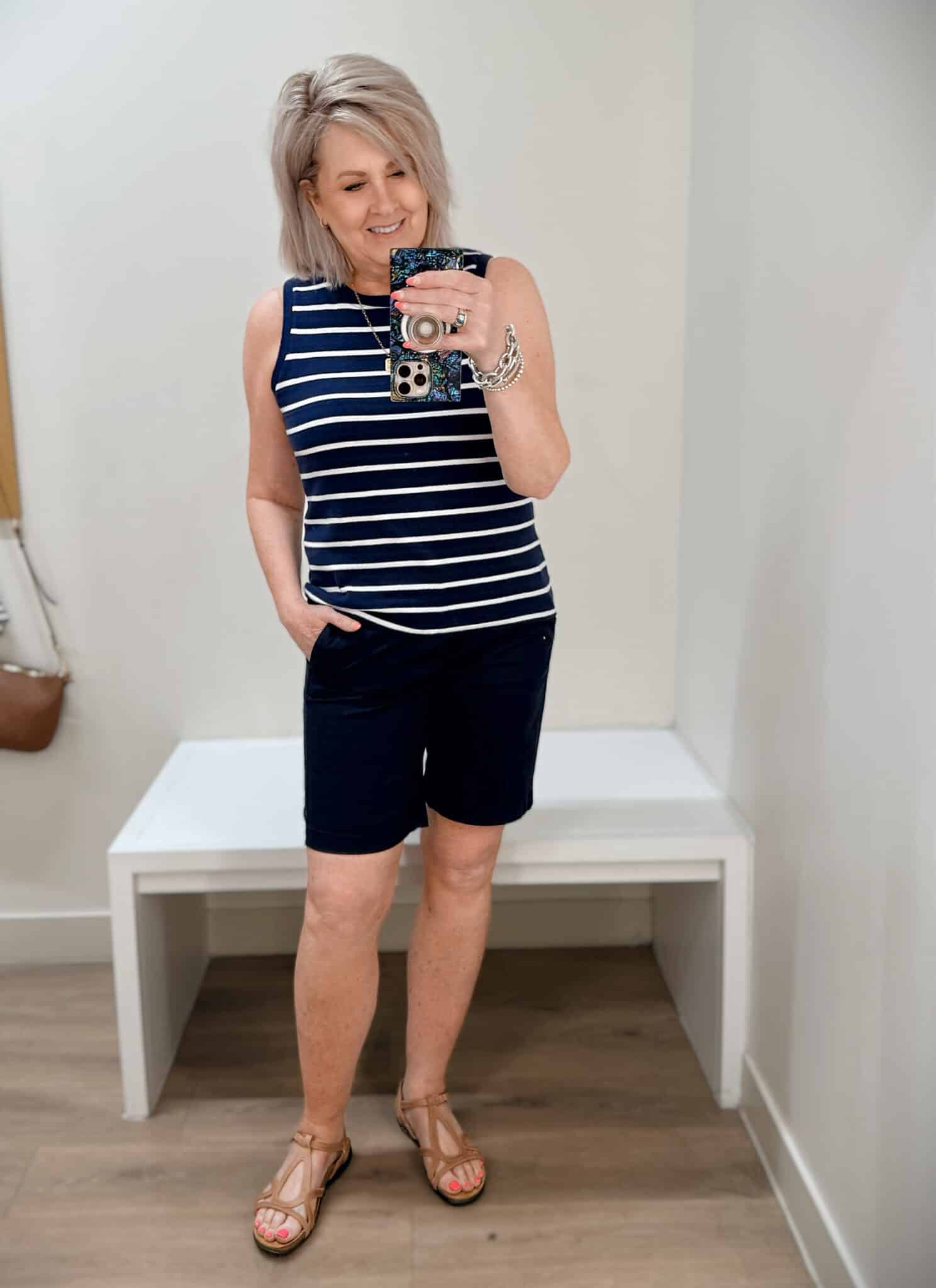 Tania wearing a striped vest and bermuda shorts from J.Crew Factory
