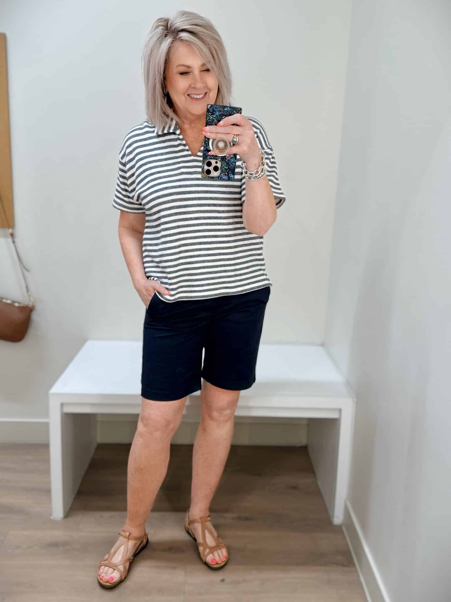 Tania wearing a striped v-neck collared top and bermuda shorts from J.Crew Factory