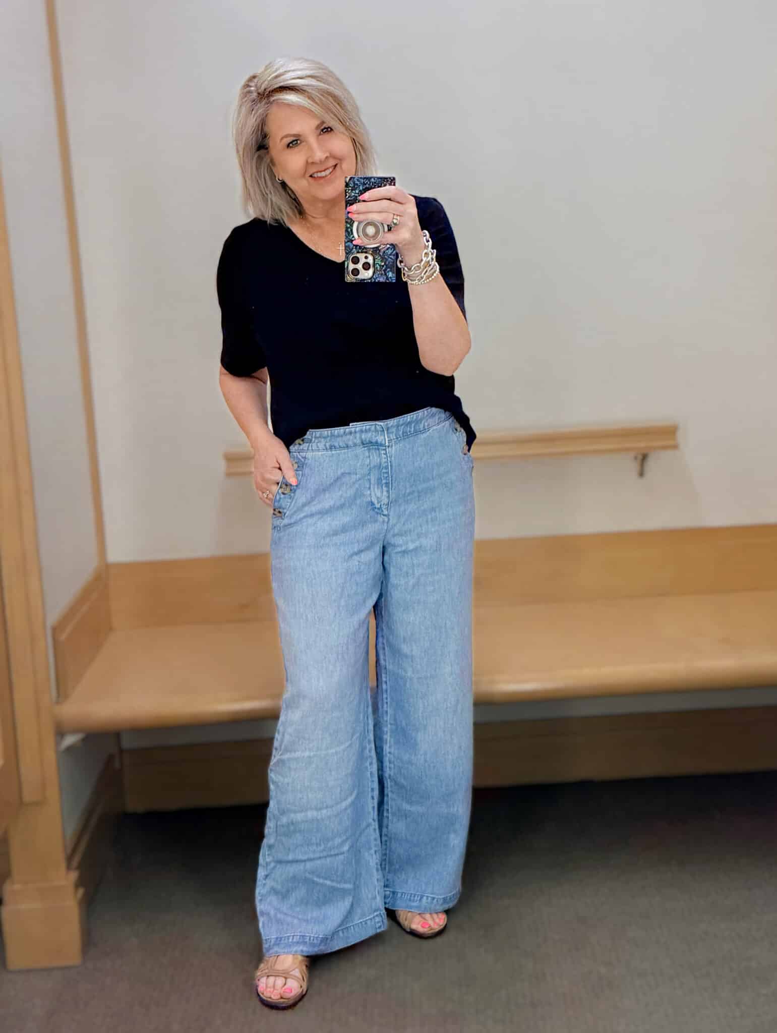 Tania wearing a navy v-neck tee with lightweight sailor