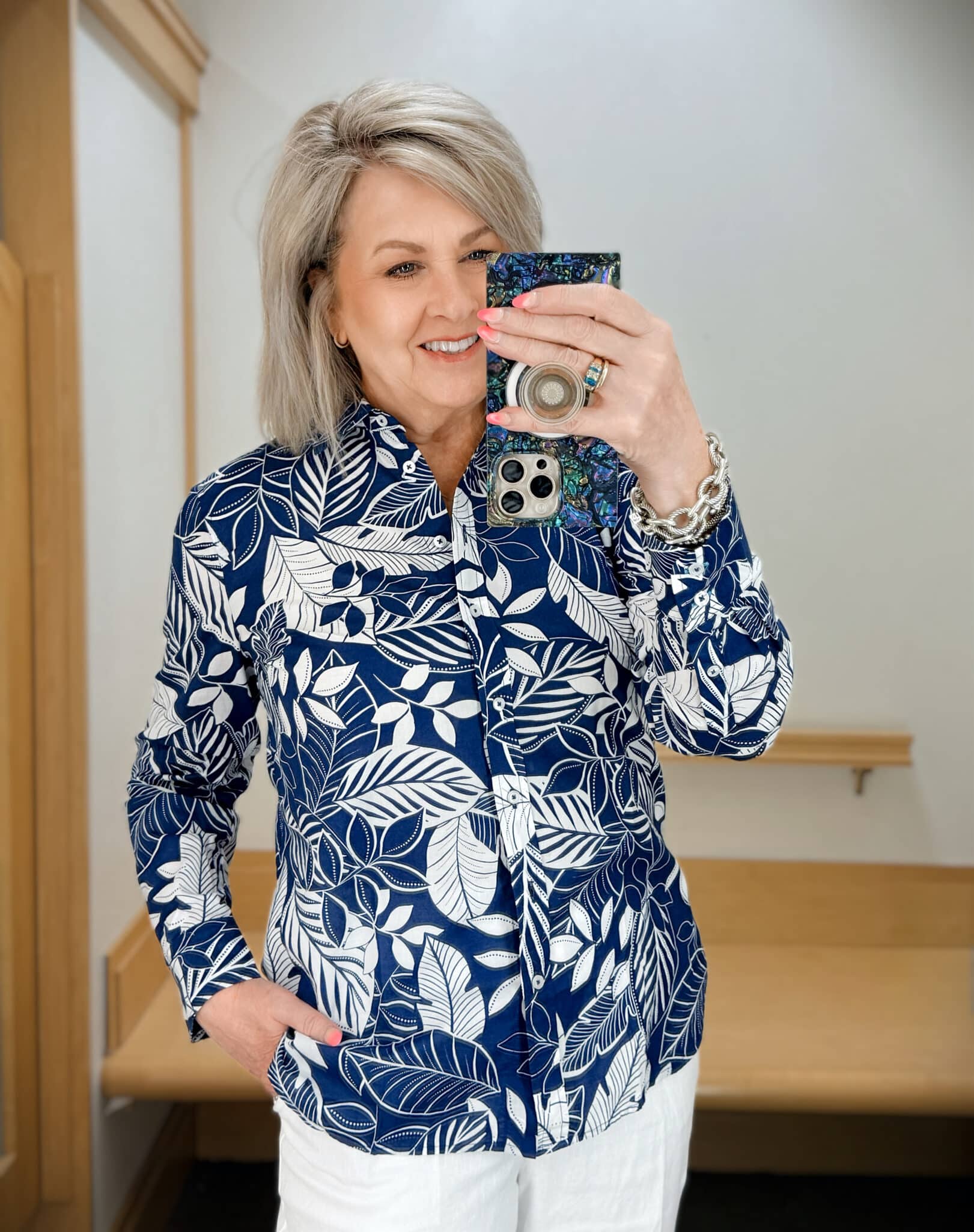Tania wearing a navy and white floral button up shirt from Talbots