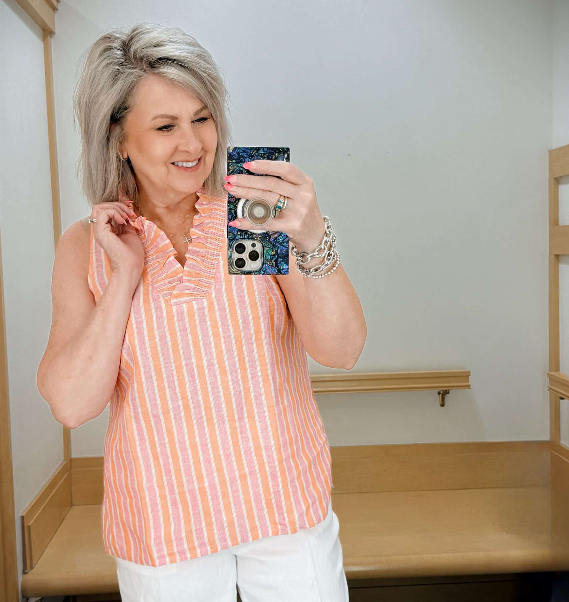 Tania wearing a peach striped ruffle top from Talbots