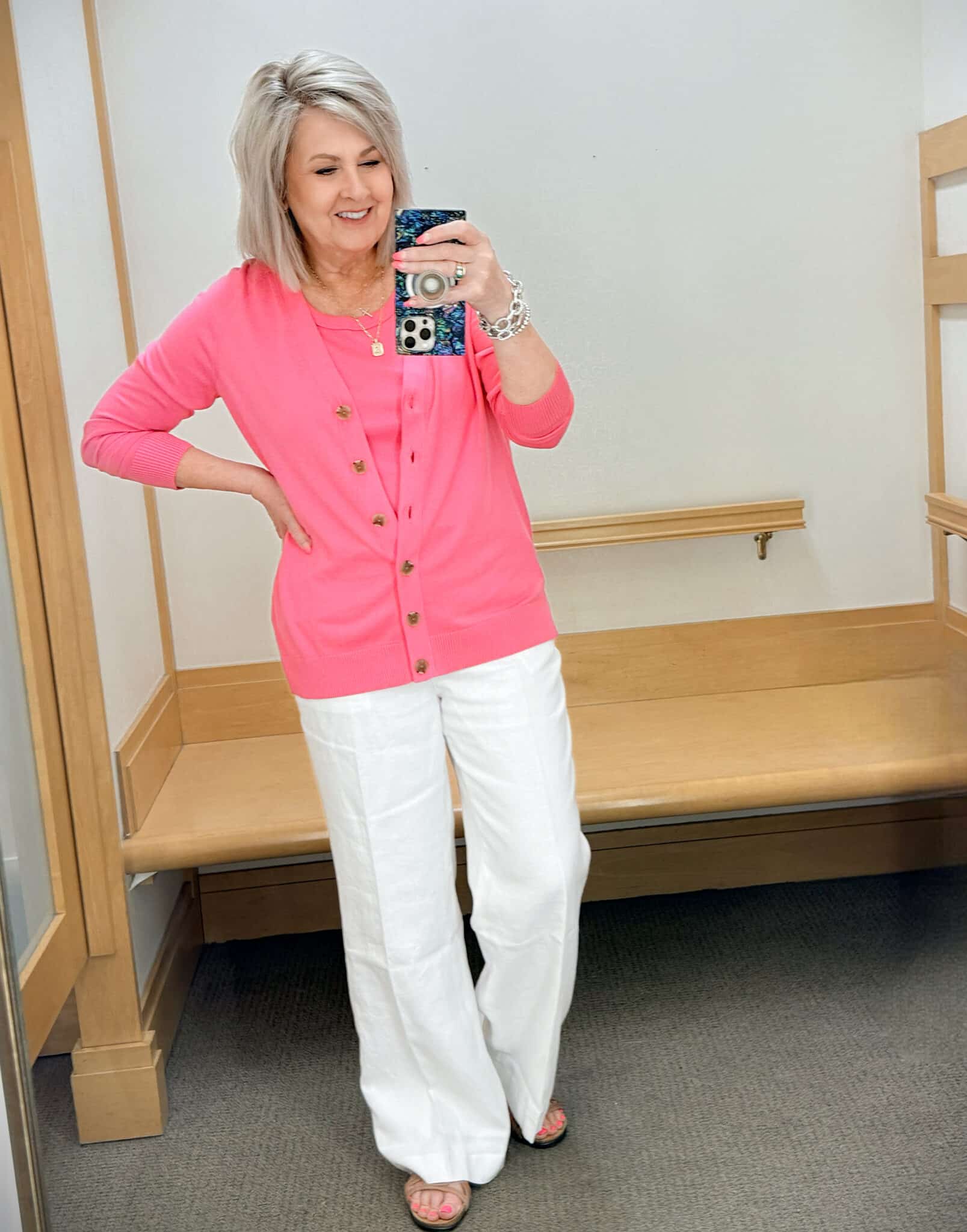 Tania wearing a pink tank and cardigan with white linen pants from Talbots