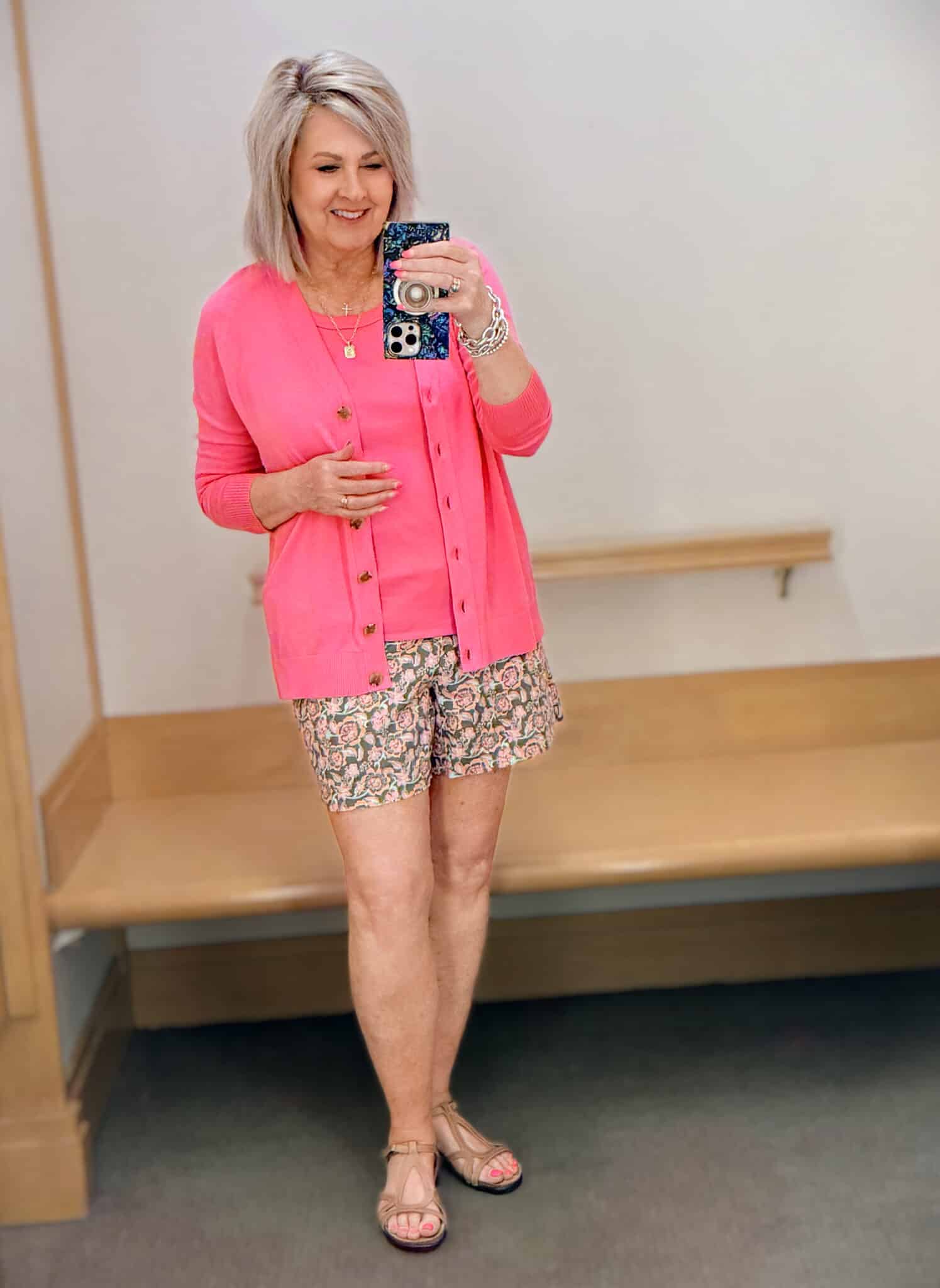 Tania wearing a pink tank and cardigan with printed shorts from Talbots