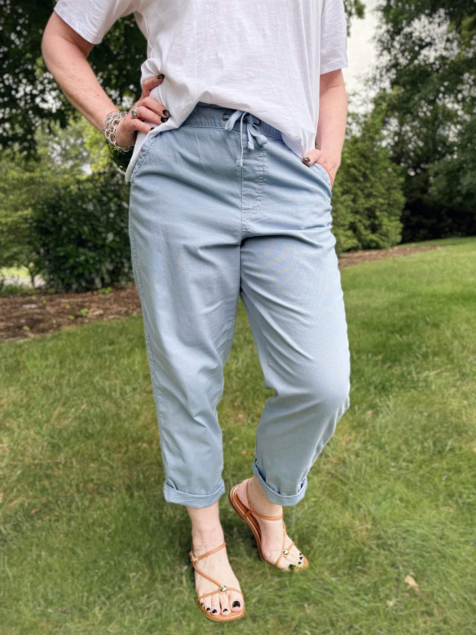 Tania is wearing blueish relaxed chino pants from Kohl's