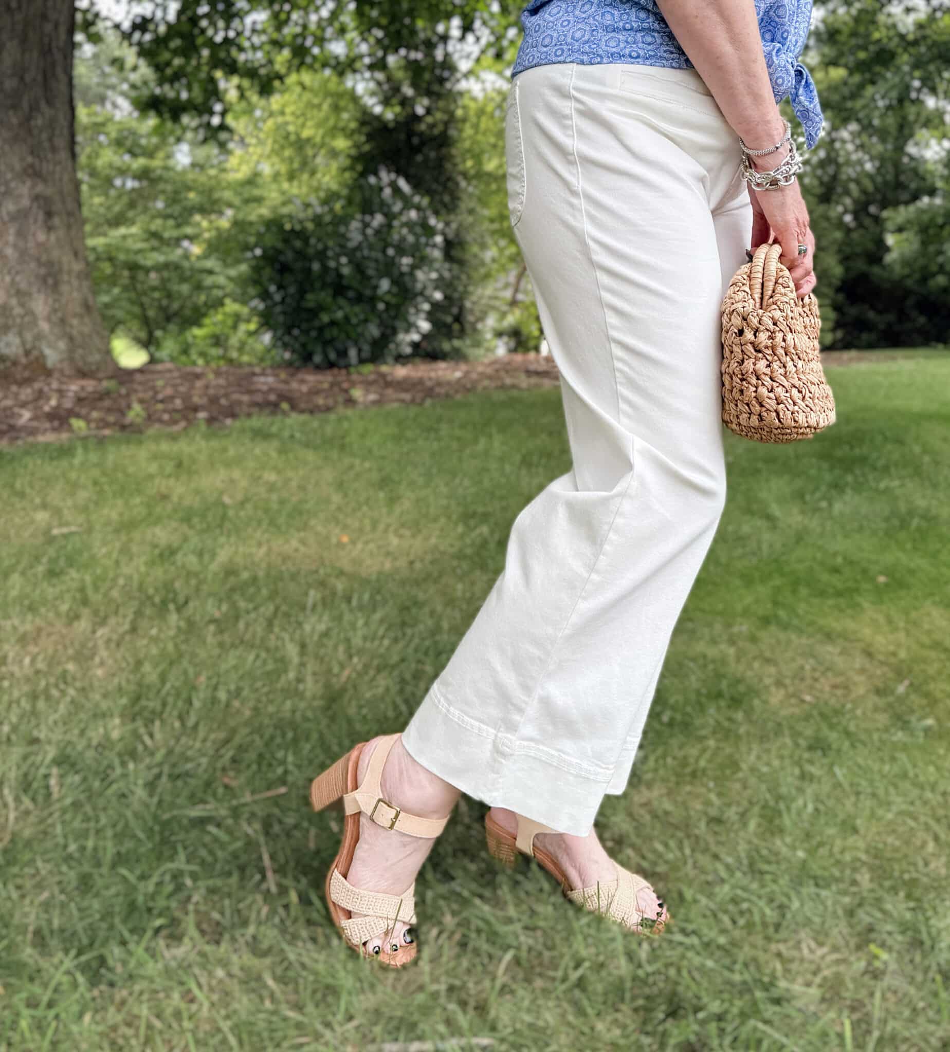 Tania is wearing white patch pocket jeans from Kohl's