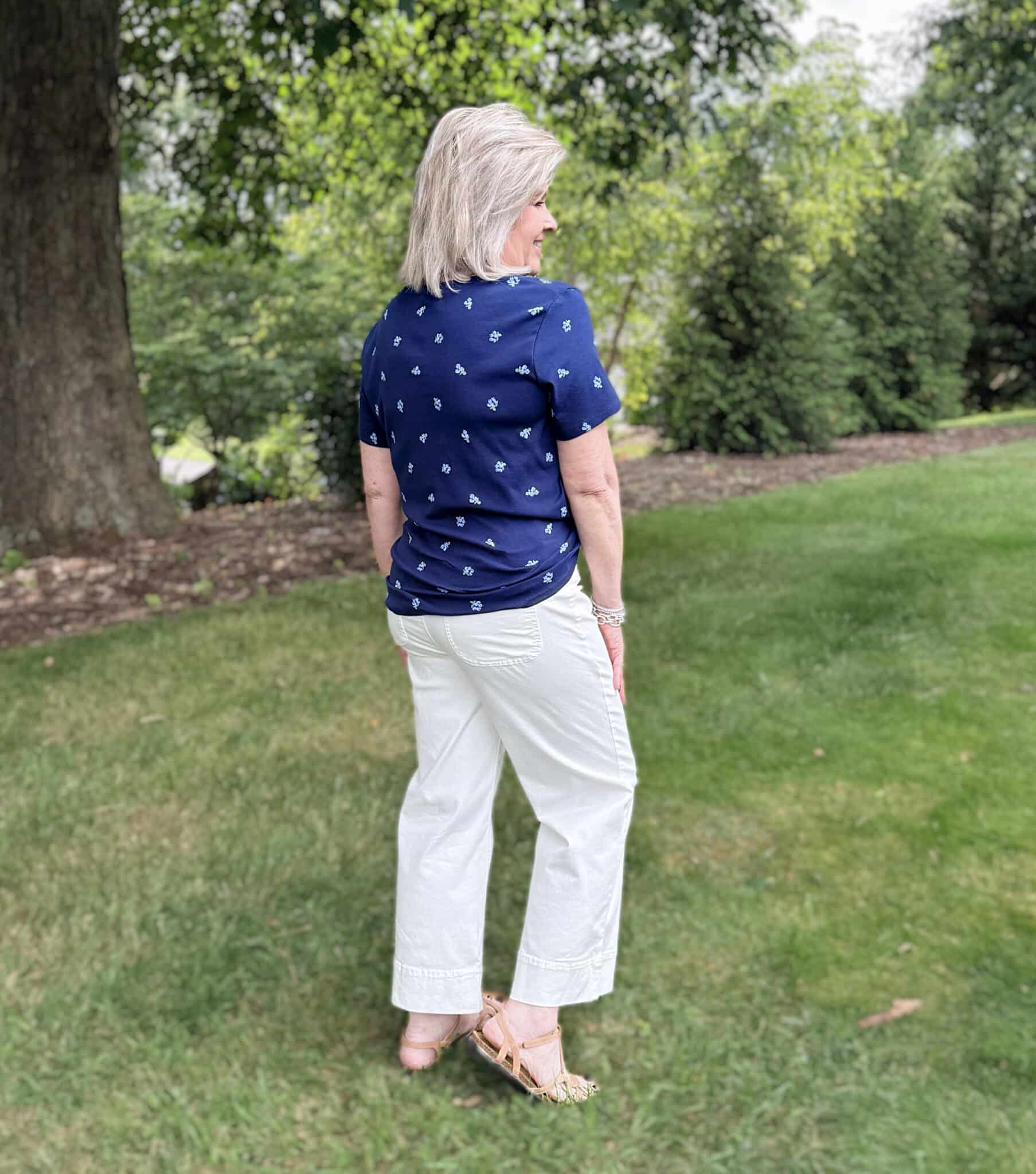 Tania is showing the back of a navy tee with white jeans from Kohl's