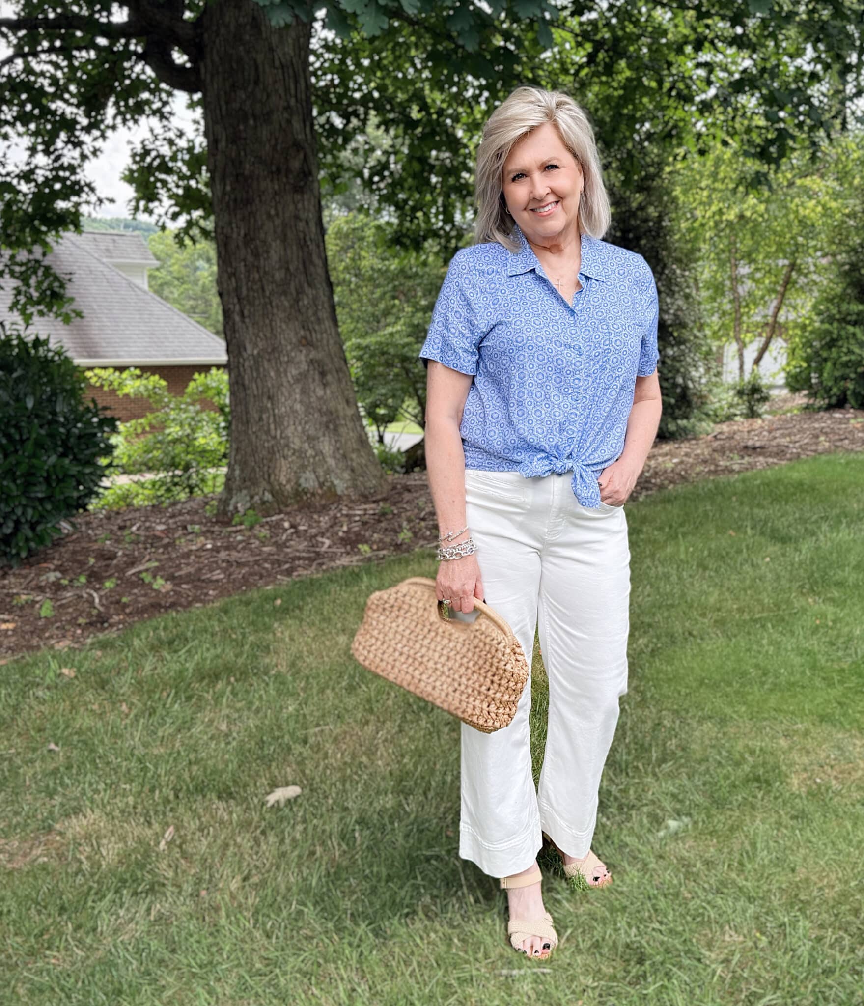 Tania is wearing a tied blue button shirt with white patch pocket jeans from Kohl's