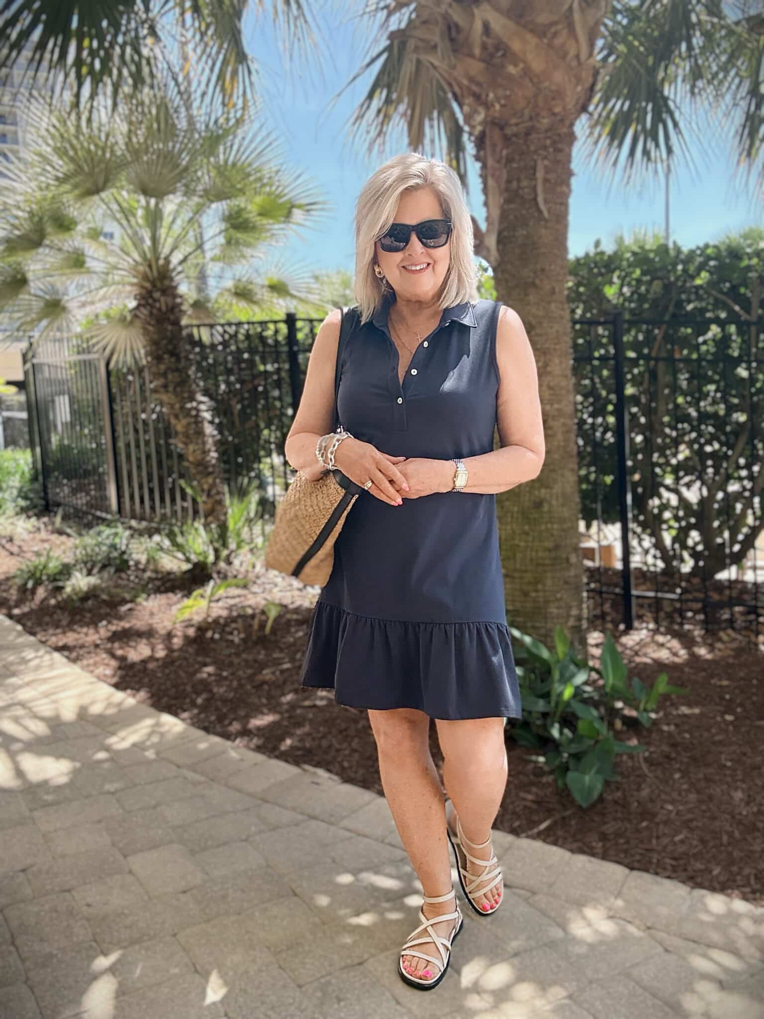 Tania wearing a navy flounce dress from Spartina 449