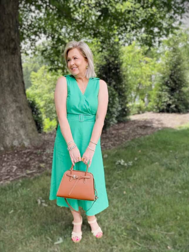Tania wearing a vibrant green bleted dress by Tommy Hilfiger