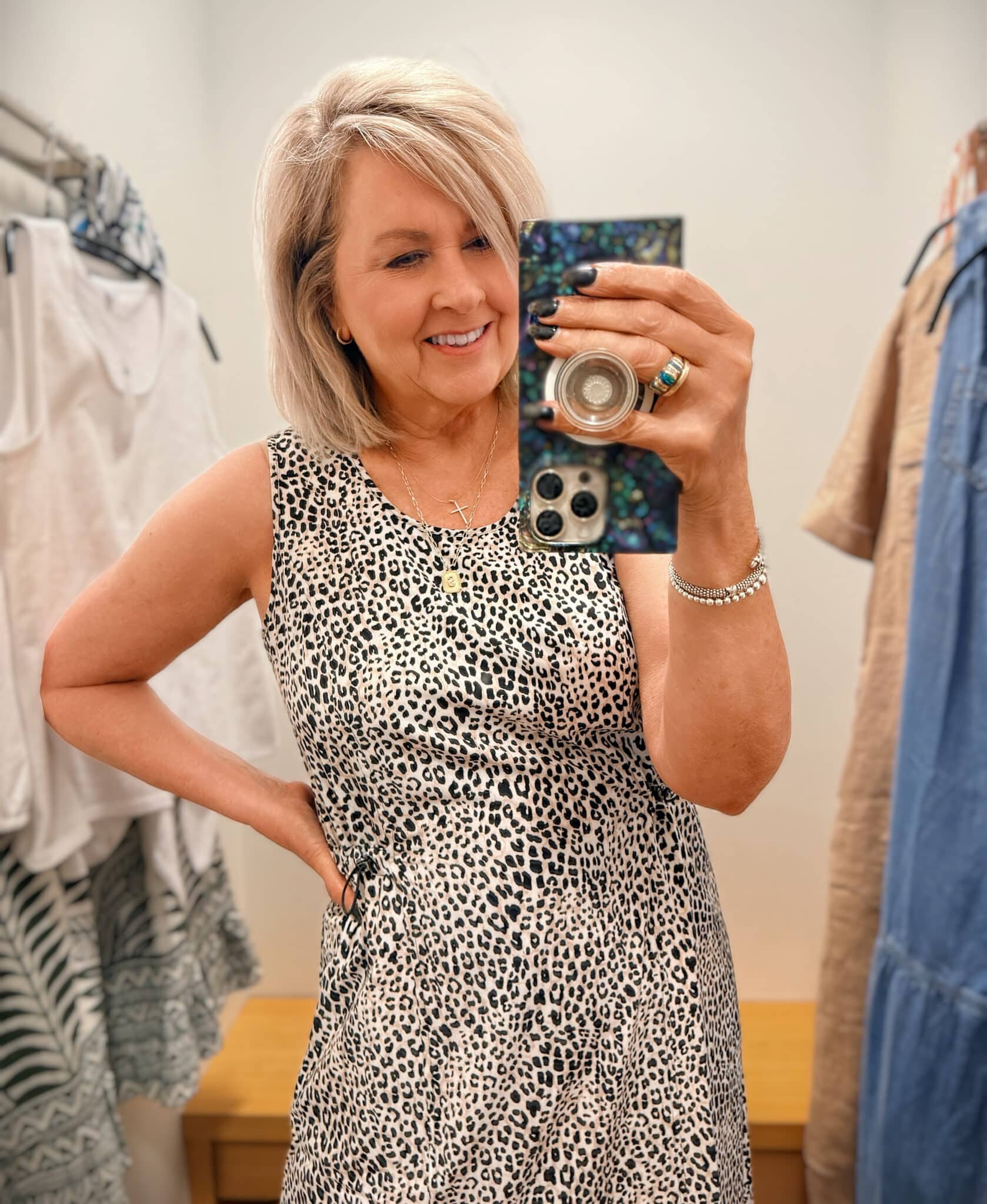 Tania wearing an animal print toggle dress from Chico's
