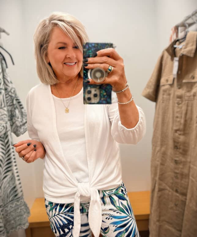 Tania Wearing a white tie cardigan and white tank top from Chico's