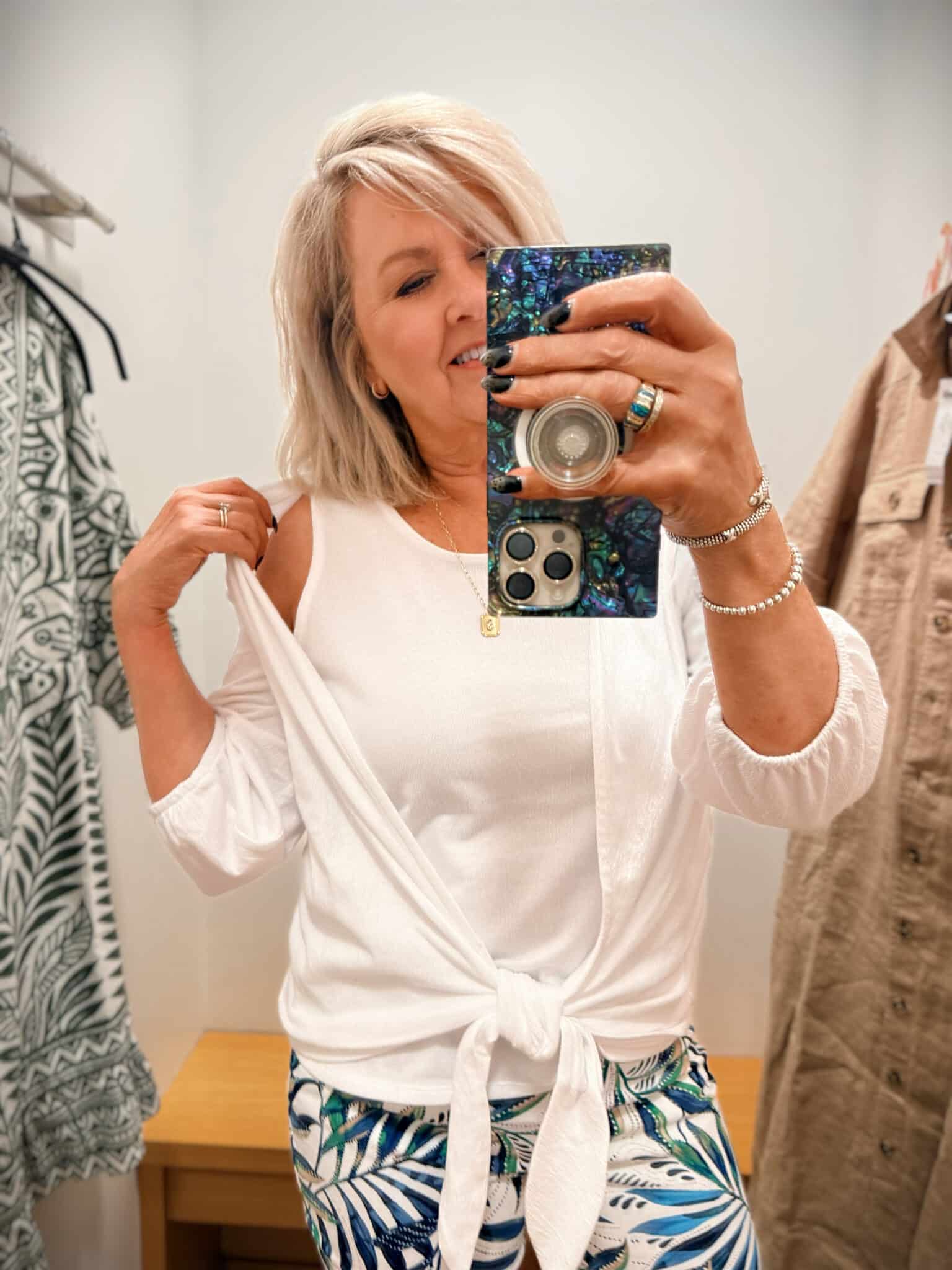 Tania showing a white tank top from Chico's